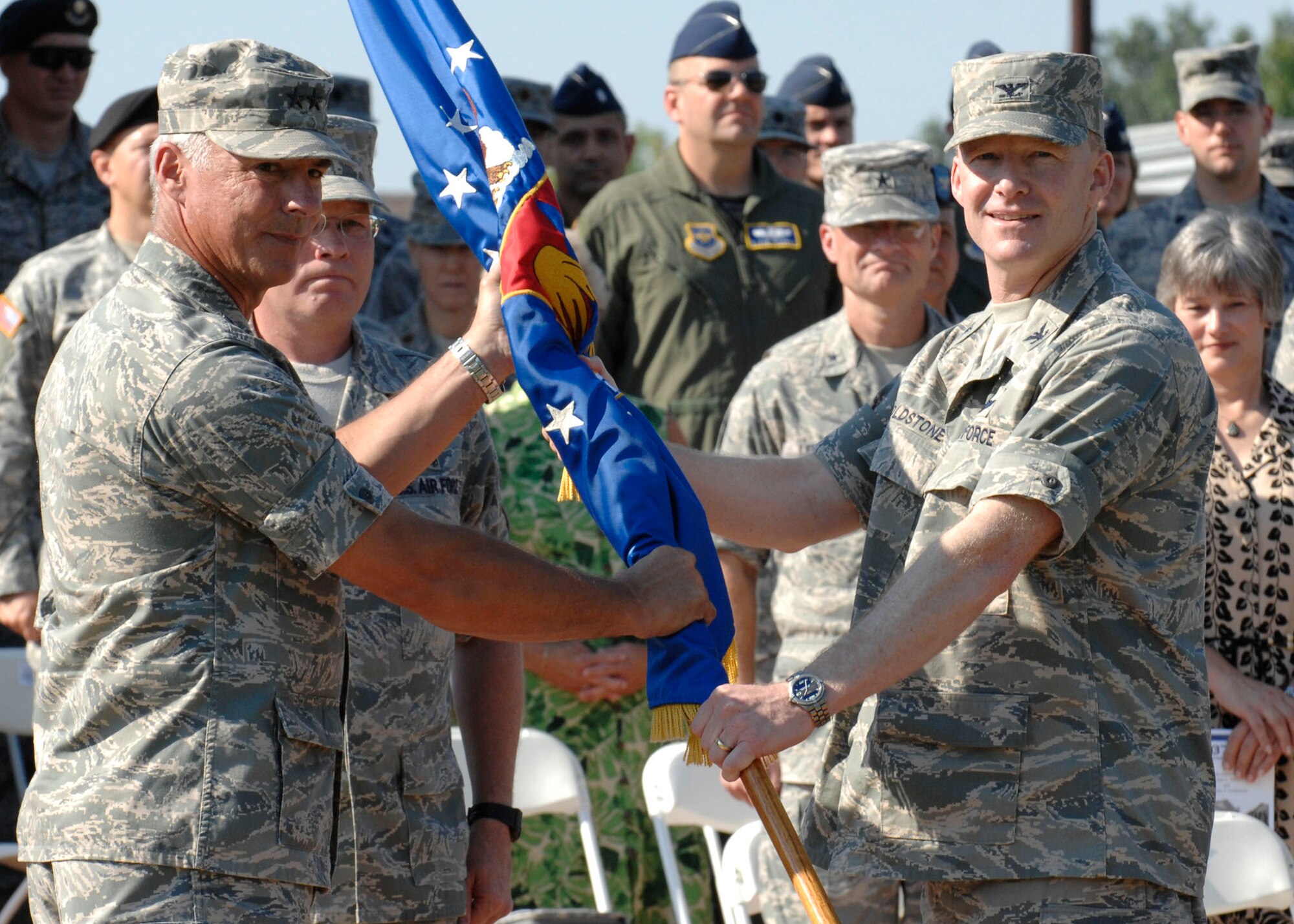 SCOTT AIR FORCE BASE, Ill. -- Maj. Gen. Winfield Scott, 18th air force cmmander passes the guidon of the 375th Airlift wing to the new commander Col. Gary Goldstone during a change of command ceremony.
(US Air Force photo/Senior airman Jonathan Lovelady)