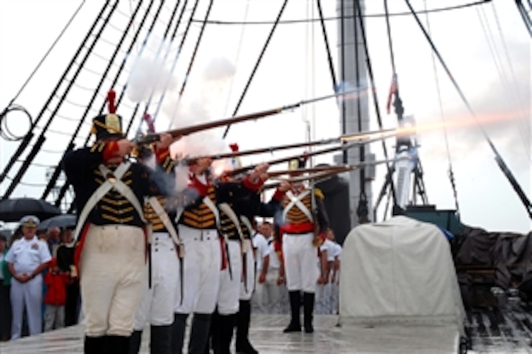 The 1812 Marines demonstrate a musket firing exercise during the USS Constitution vs. HMS Guerriere Battle Commemoration at Charlestown Navy Yard, Mass., Aug. 15, 2008. More than 65 guests and military officials joined the captain and crew for this second annual observance of the battle. The Constitution earned her nickname Old Ironsides Aug. 19, 1812, when 18-pound iron round shot from the British frigate bounced harmlessly off her oak hull. 