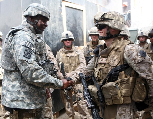RAMADI, Iraq (August 21, 2008) – (left) Lt. Gen. Lloyd J. Austin III, the Multi National Corps-Iraq commander, shakes hands with Cpl. Philip R. Jedras, an amphibious assault vehicle crewman, during a recent visit to Ramadi August 21. During his two-hour visit, Austin emphasized his appreciation for the service members’ dedication and hard work. “I just wanted to say thank you for all that you have done,” Austin said. “You’re doing a lot of hard work out here and I am proud to be on your team.” (Official U.S. Marine Corps photo by Lance Cpl. Casey Jones) (RELEASED)