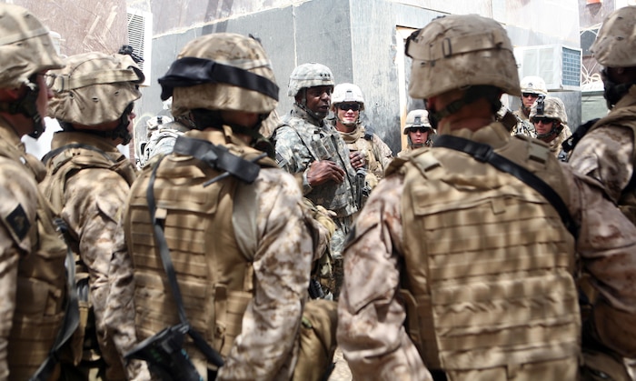 RAMADI, Iraq (August 21, 2008) – (center) Lt. Gen. Lloyd J. Austin III, the Multi National Corps-Iraq commander, speaks with Marines during a two-hour visit to Ramadi August 21. Austin recognized the service members’ efforts in helping the city get to where it is now. “What you’ve done here is remarkable,” Austin said. “You made a difference and you should feel good about that. You’ve earned the respect of the people in this area and what you’re doing here has really set the stage for the city to maintain its development, and for its citizens to continue to feeling safe.” (Official U.S. Marine Corps photo by Lance Cpl. Casey Jones) (RELEASED)