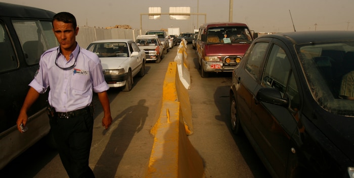 FALLUJAH, Iraq (Aug. 21, 2008) – An Iraqi Police officer roves an entry control point on the outskirt of Fallujah, Aug. 21. ECPs are the first line of defense before entering the city of Fallujah, and the checkpoints are being rebuilt to allow more traffic to enter the city. More commercial traffic ultimately means economic growth for the city. (Official U.S. Marine Corps photo by Cpl. Chris Lyttle) (RELEASED)