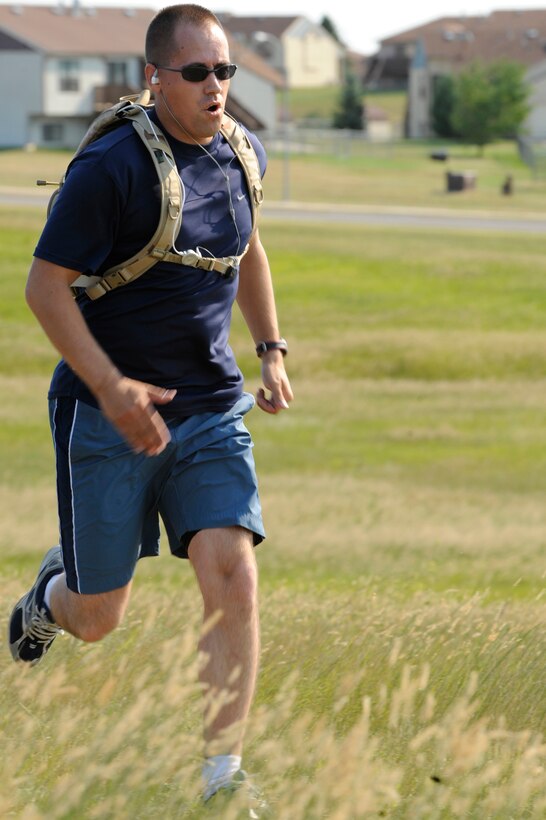 Staff Sgt. Daniel Hogue, 28th Logistics Readiness Squadron fuel systems supervisor, runs to the finish line during the first part of the Raider Challenge Off-Road Biathlon here Aug. 22. The challenge consisted of a three mile run and a 9.3 mile bike ride. (U.S. Air Force photo/Airman Matthew Flynn)

