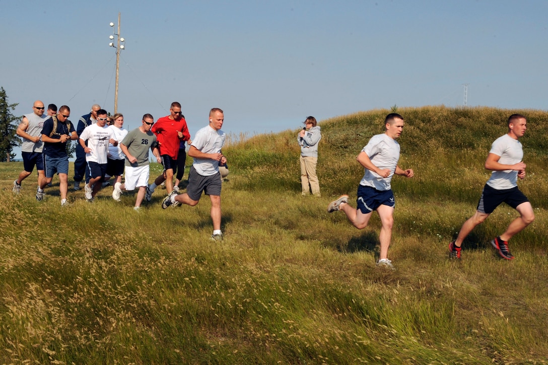 Airmen begin the Raider Challenge Off-Road Biathlon here Aug. 22.  Twenty Airmen participated in the event that consisted of a three mile run and a 9.3 mile bike ride. (U.S. Air Force photo/Airman Matthew Flynn)