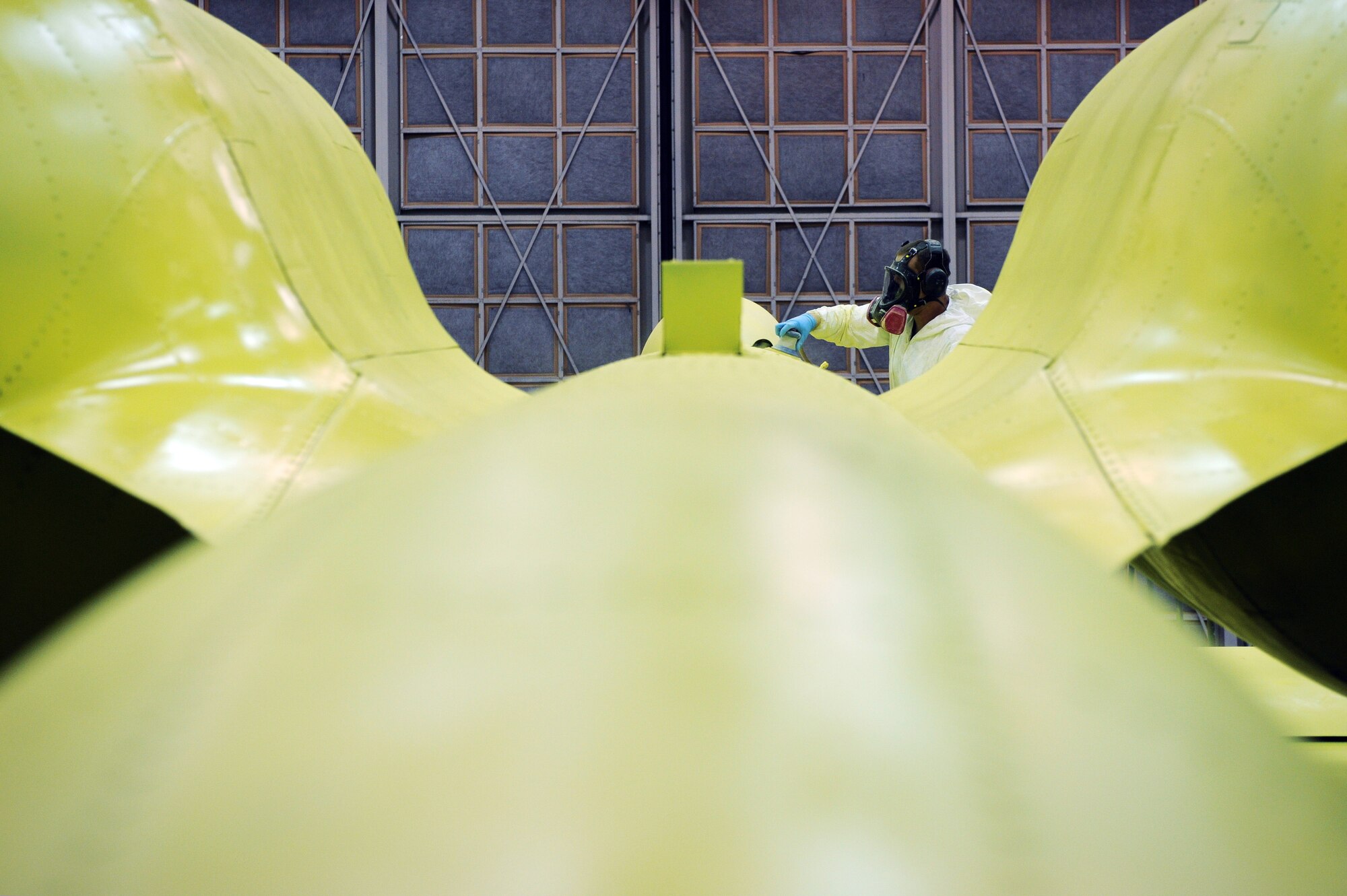 Airman 1st Class Timothy Coulson sands down the primer on an A-10 Thunderbolt II Aug. 20 at Eielson Air Force Base, Alaska, to prepare it for its base coat of paint. Members of the 354th Maintenance Squadron fabrication shop are working on restoring this A-10 to be a static display in the base's Heritage Park. This aircraft will be a permanent reminder of the 355th Fighter Squadron's presence here before its deactivation in 2007.  (U.S. Air Force photo/Airman 1st Class Jonathan Snyder) 
