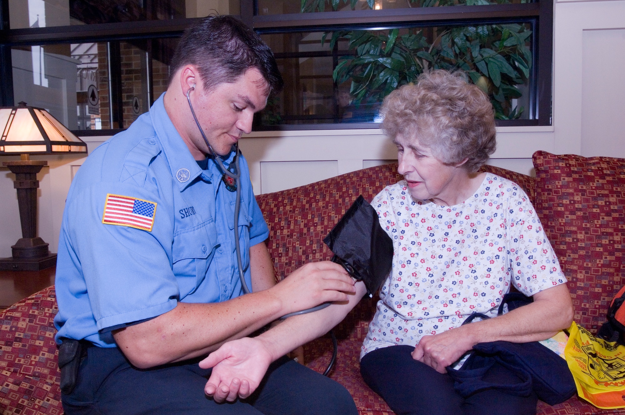 GRISSOM AIR RESERVE BASE, Ind., -- Robert Short, fire fighter with the Grissom Fire Department, checks the blood pressure of a visitor to the recent Military Retiree Appreciation Day. The fire department was one of several Grissom agencies involved in supporting military retirees. (U.S. Air Force photo/Tech. Sgt. Doug Hays)