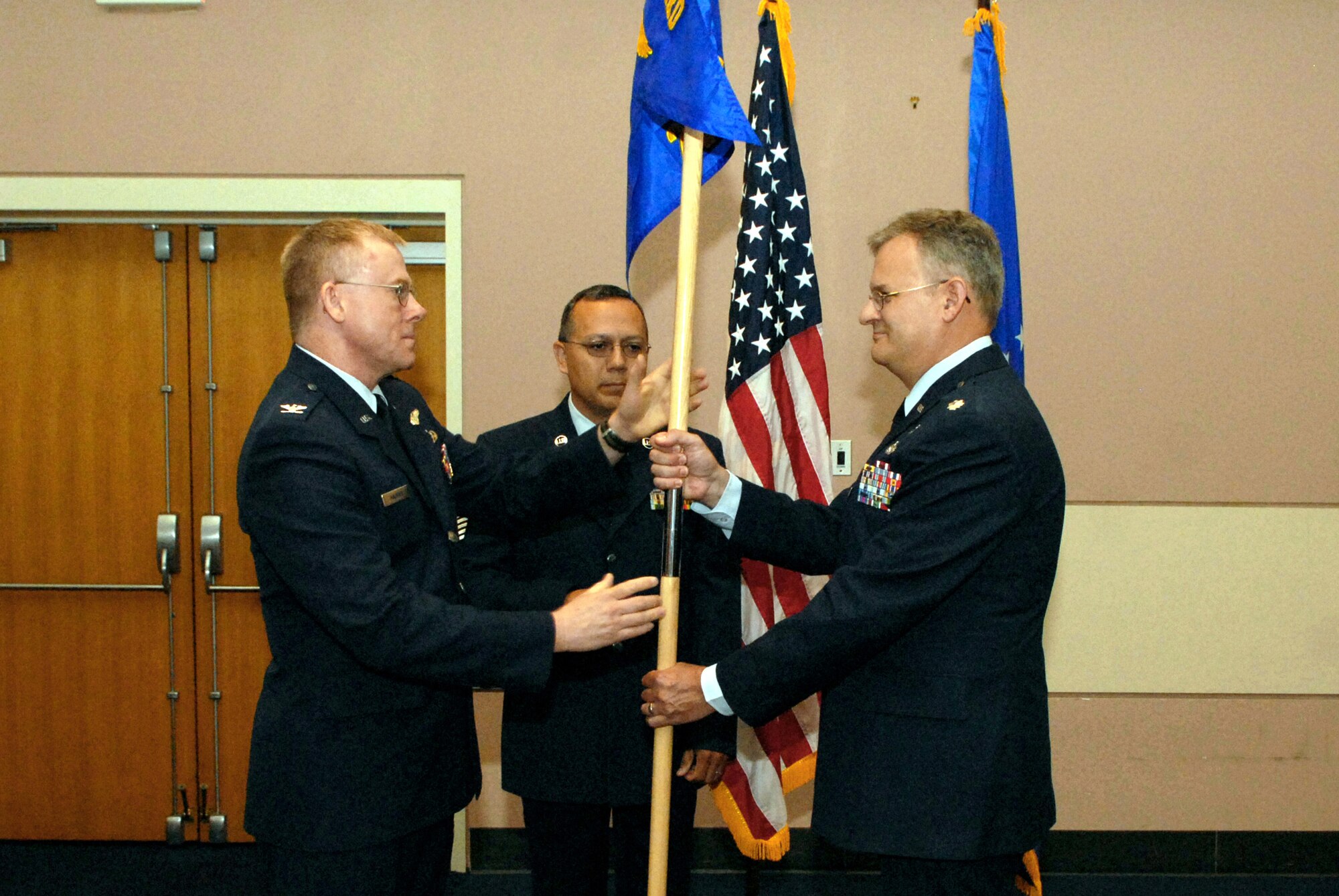 Lieutenant Colonel James Marrs (right), 217th Training Squadron commander, receives the guidon from Col. Russ Malesky, Director of Staff, Texas Air National Guard, as he assumes command of the 217 TRS Aug. 15. (U.S. Air Force photo by Senior Airman Kasabyan Musal)