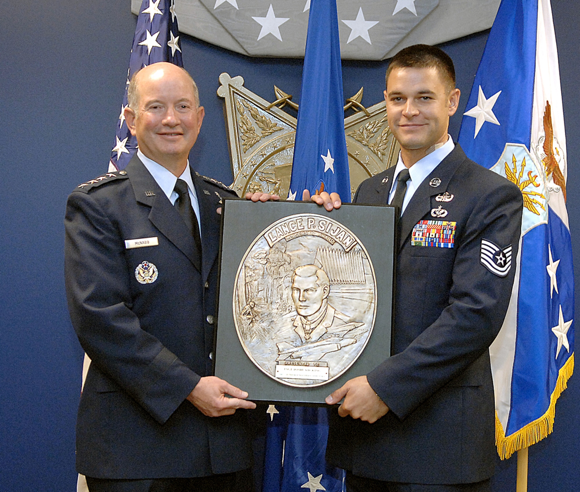 Vice Chief of Staff of the Air Force Gen. Duncan J. McNabb presents the Lance P. Sijan Air Force Leadership Award to Tech. Sgt. Joshua D. King in a ceremony Aug. 20 at the Pentagon. Sergeant King is an explosive ordnance disposal team leader with the 366th Civil Engineer Squadron at Mountain Home Air Force Base, Idaho. The Sijan Award recognizes Airmen who demonstrated outstanding leadership while assigned to an organization at the wing level or below. (U.S. Air Force photo/Andy Morataya) 