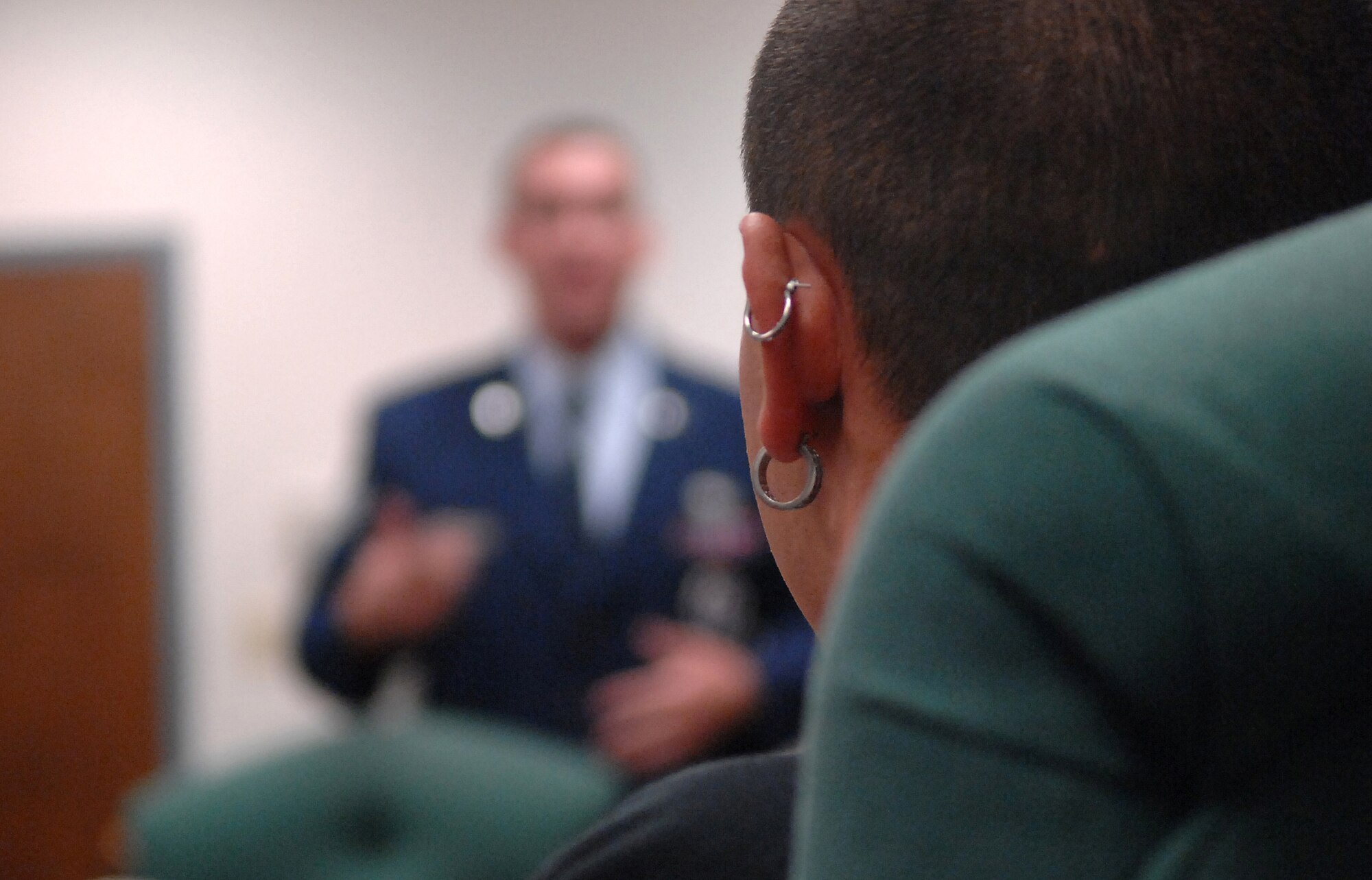 Anthony, 18, listens as Air Force recruiter Staff Sgt. Richard Cordova talks about the benifits of "crossing into the blue."