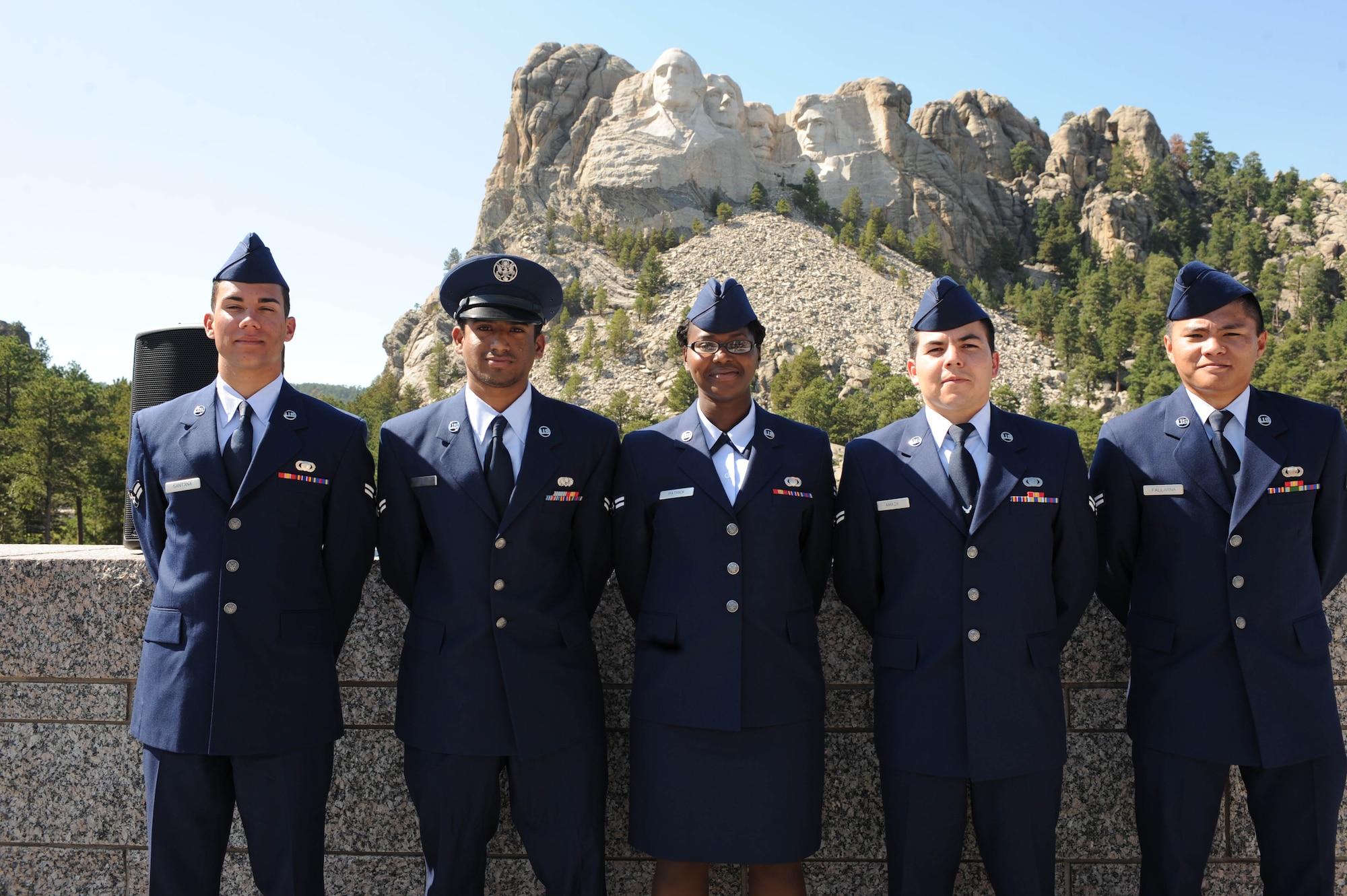 Five Airmen from Ellsworth took the last step to become United States citizens by swearing the oath of allegiance at Mount Rushmore National Memorial, S.D., Aug. 21. From left to right, America's newest citizens are: Airmen 1st Class Vinicius Santana, Sanaka Patrick, Luciano Amaza, Ronald Fallarna, all assigned to the Air Force Financial Service Center, and Airman 1st Class Tarun John, 28th Civil Engineer Squadron. (U.S. Air Force photo /Airman 1st Class Adam Grant)
