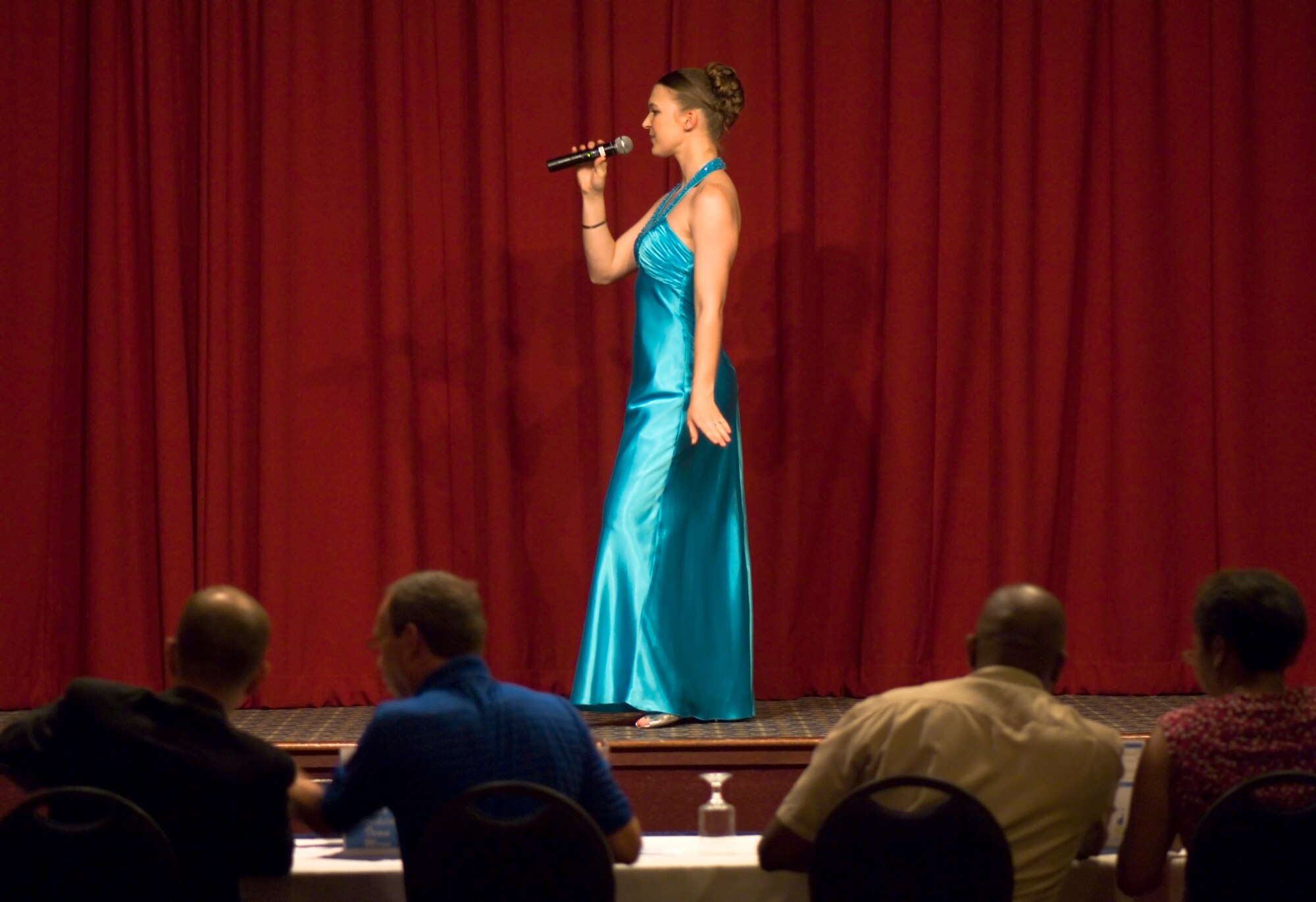 FAIRCHILD AIR FORCE BASE, Wash. – Airman 1st Class Alexandra Burgeson, 141st Air Refueling Wing, strikes a pose as she prepares to perform during the AMC Icon finalist round here Aug. 15. This year marks the first ever singing competition in the Air Mobility Command. The winner from Fairchild, Airman 1st Class Johanna Brooks, 141st Air Refueling Wing, will be flown to Scott Air Force Base, Ill., where she will compete for the top AMC Icon position for all AMC bases. (U.S. Air Force photo / Airman 1st Class Joshua K. Chapman)