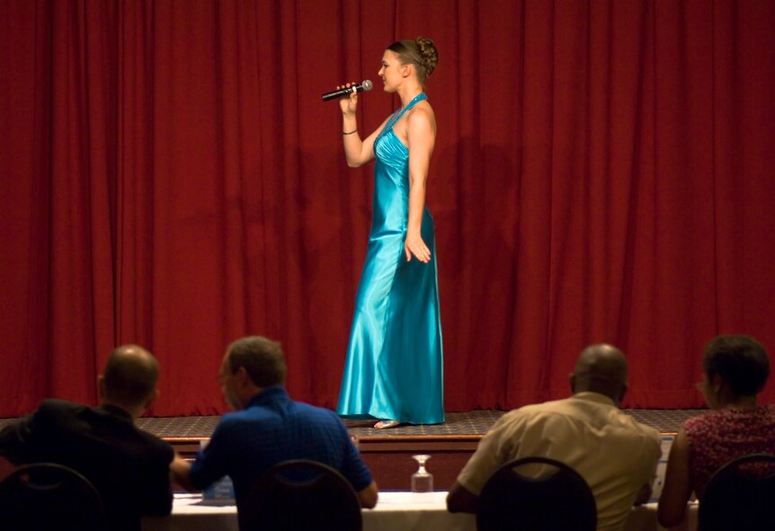 FAIRCHILD AIR FORCE BASE, Wash. – Airman 1st Class Alexandra Burgeson, 141st Air Refueling Wing, strikes a pose as she prepares to perform during the AMC Icon finalist round here Aug. 15. This year marks the first ever singing competition in the Air Mobility Command. The winner from Fairchild, Airman 1st Class Johanna Brooks, 141st Air Refueling Wing, will be flown to Scott Air Force Base, Ill., where she will compete for the top AMC Icon position for all AMC bases. (U.S. Air Force photo / Airman 1st Class Joshua K. Chapman)