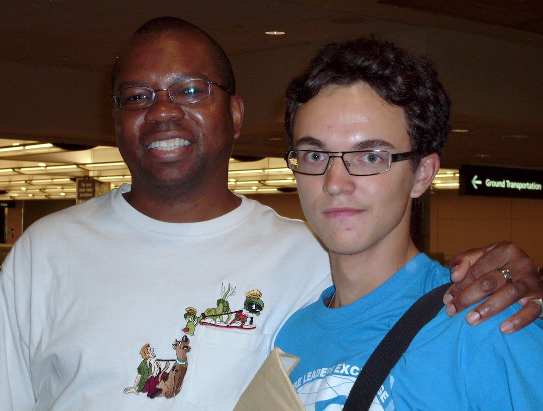 Phil Burrell (left), SC, meets foreign exchange student, Igor Myakotim, at Denver International Airport on Aug. 6. Mr. Burrell is a volunteer host parent with the Future Leaders Exchange program, a foreign exchange student program sponsored by the U.S. Department of State that allows teenagers from the former Soviet Union to live and go to high school in the United States for a year. (Courtesy photo)