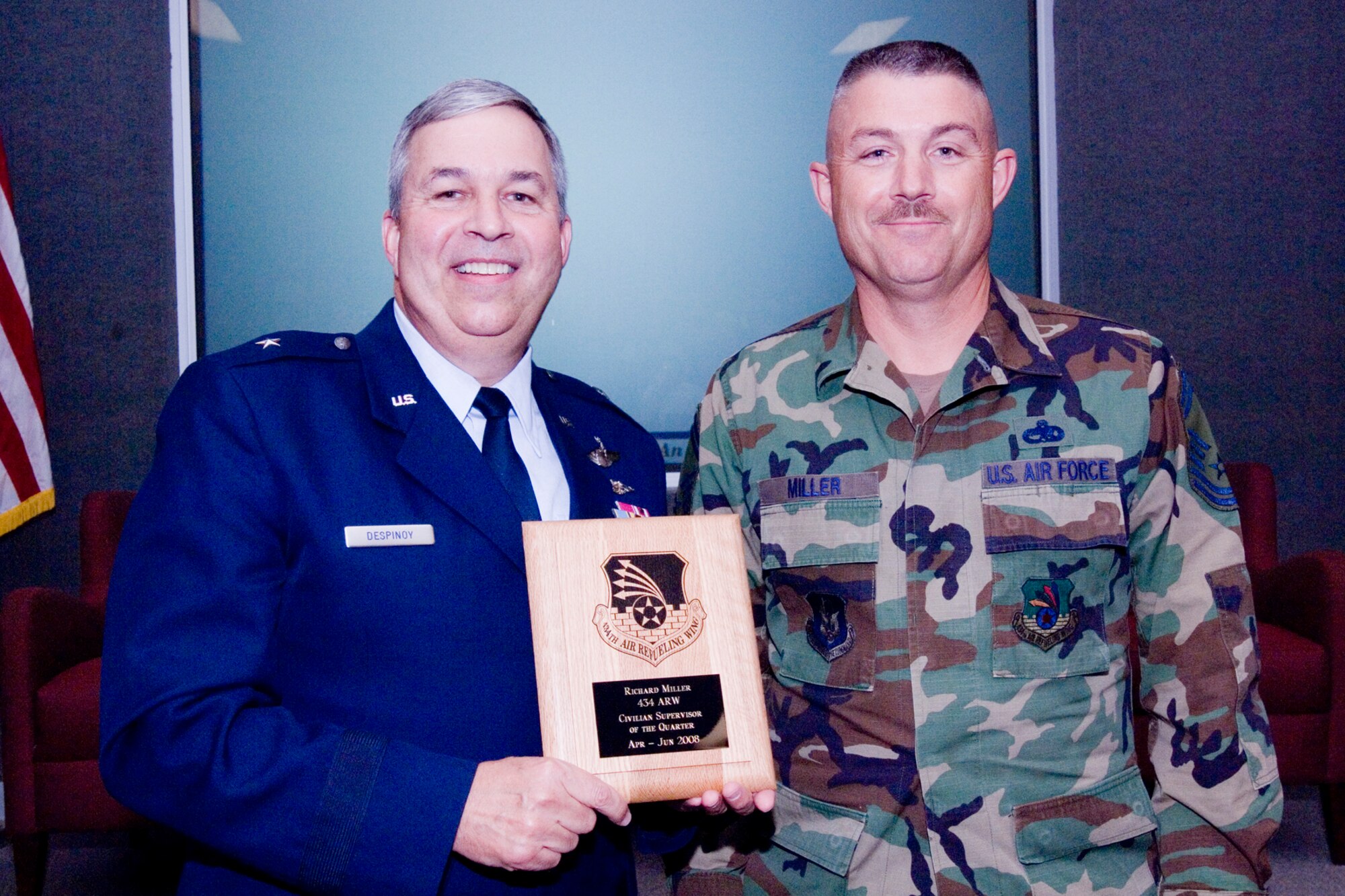 GRISSOM AIR RESERVE BASE, Ind., -- Brig. Gen. Dean Despinoy, 434th Air Refueling Wing commander, left, presents a plaque to Senior Master Sgt. Richard Miller, 434th Aircraft Maintenance Squadron, on his selection as the supervisor of the quarter. The presentation was made as part of a civilian commander's call held recently. (U.S. Air Force photo/Tech. Sgt. Doug Hays)