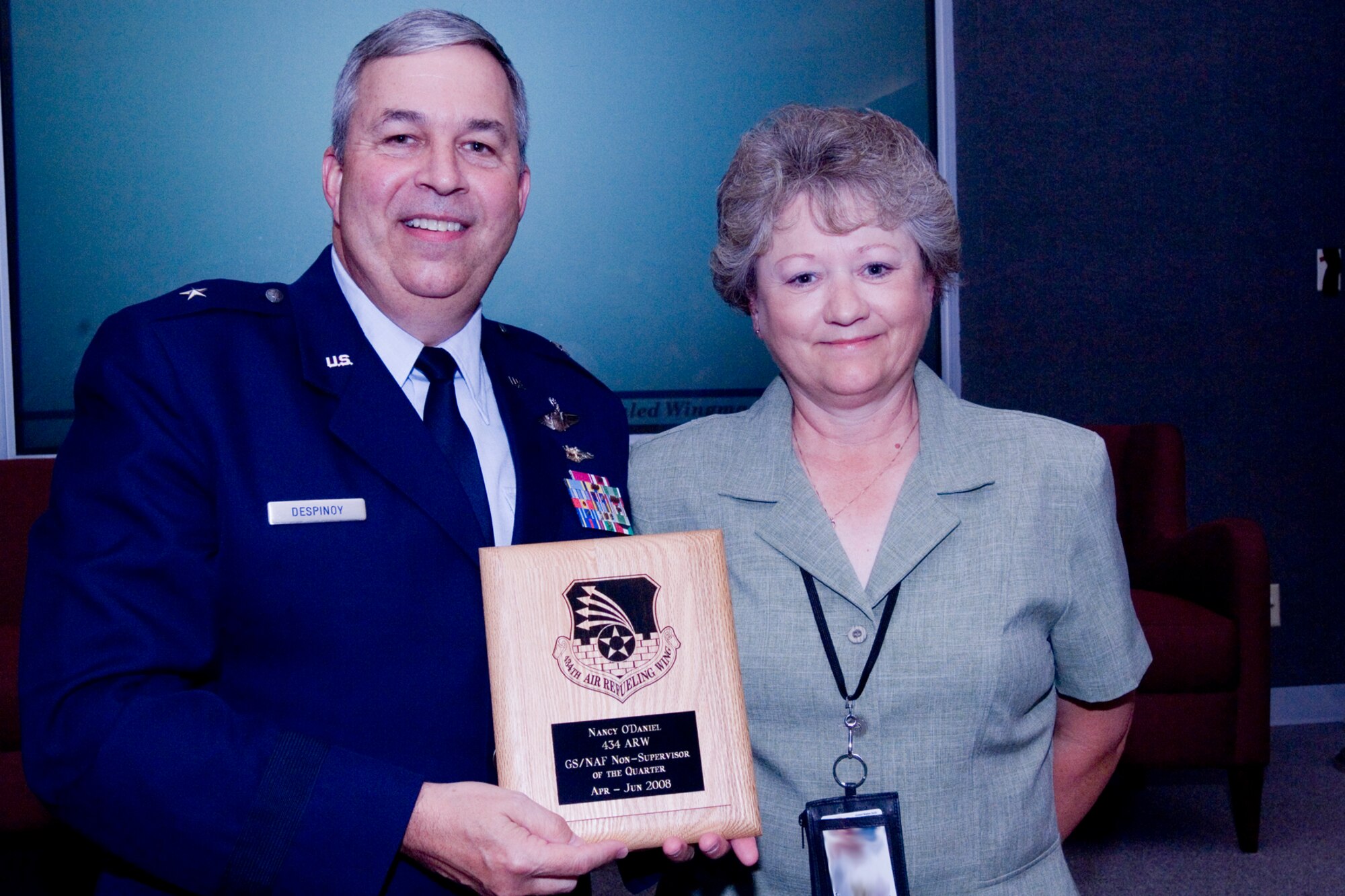 GRISSOM AIR RESERVE BASE, Ind., -- Nancy O'Daniel, 434th Aircraft Maintenance Squadron, receives a plaque from Brig. Gen. Dean Despinoy, 434th Air Refueling Wing commander, on her selection as Grissom's GS/NAF non-supervisor of the quarter. The presentation was made as part of a civilian commander's held recently. (U.S. Air Force photo/Tech. Sgt. Doug Hays)