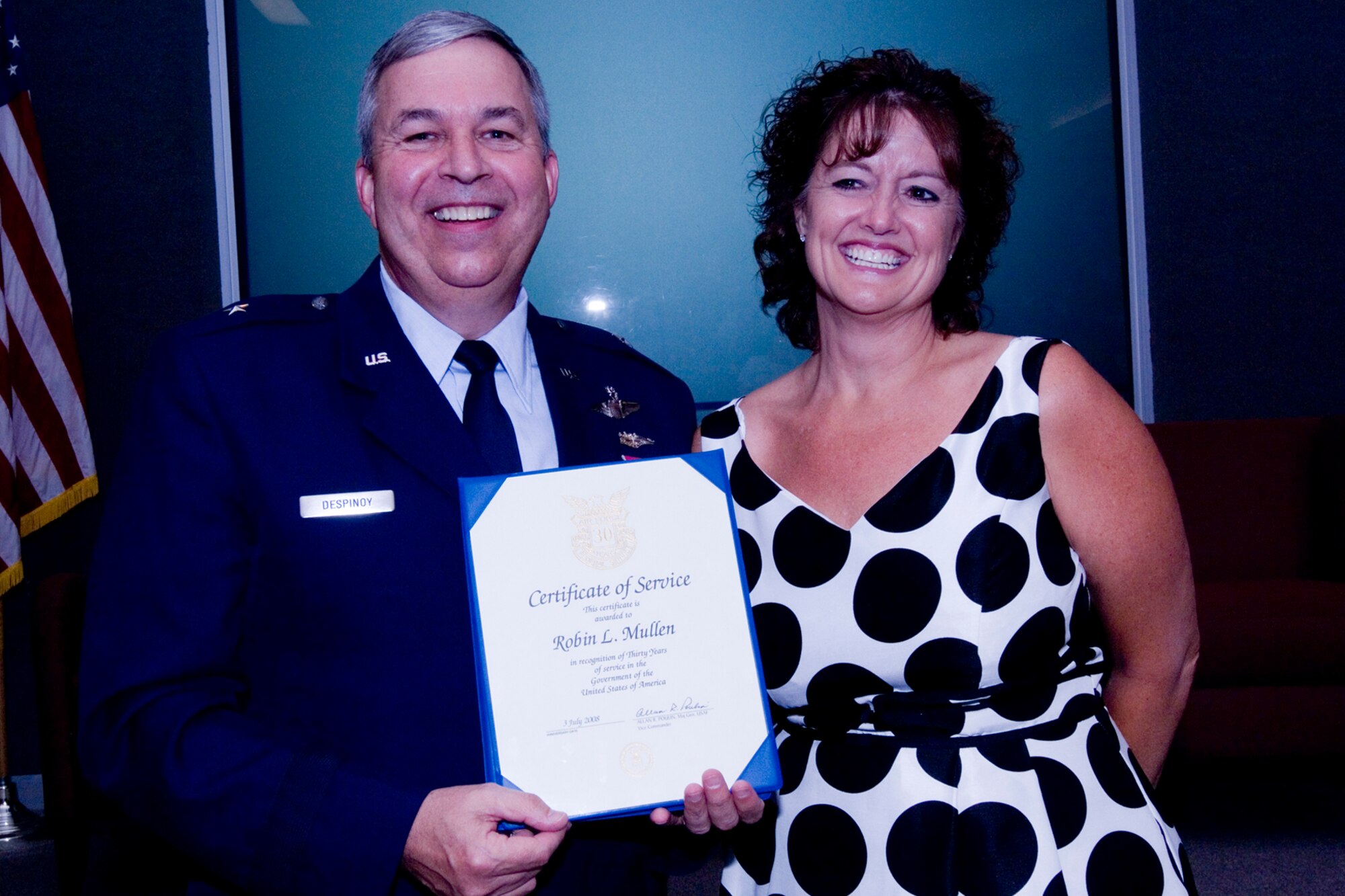 GRISSOM AIR RESERVE BASE, Ind., -- Robin Mullen, a resource advisor with the 43th Maintenance Operations Flight, receives a 30-year pin and certificate from Brig. Gen. Dean Despinoy, 434th Air Refueling Wing commander. The presentation was made as part of a civilian commander's call held recently. (U.S. Air Force photo/Tech. Sgt. Doug Hays)