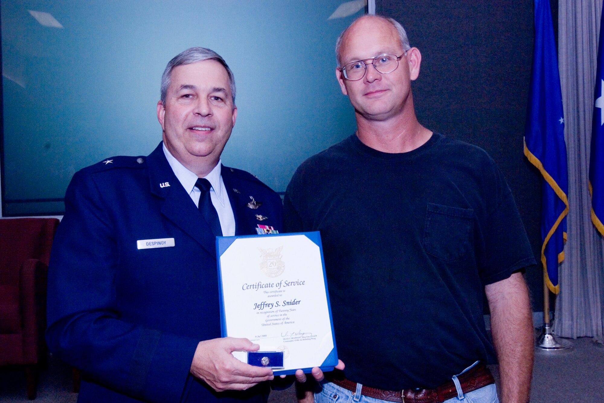 GRISSOM AIR RESERVE BASE, Ind., -- Brig. Gen. Dean Despinoy, 434th Air Refueling Wing commander, left, presents a 20-year pin and certificate to Jeffrey Snider, a pnuedraulics mechanic with the 434th Maintenance Squadron. The presentation was made as part of a civilian commander's call held recently. (U.S. Air Force photo/Tech. Sgt. Doug Hays)