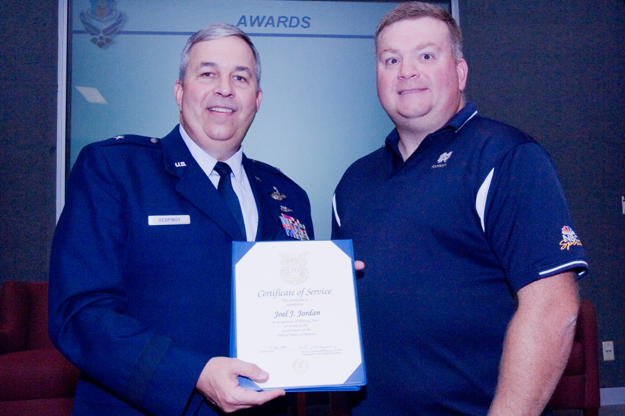 GRISSOM AIR RESERVE BASE, Ind., -- Brig. Gen. Dean Despinoy, 434th Air Refueling Wing commander, left, presents a certificate to Joel Jordan, 434th Operations Support Squadron, commemorating Mr. Jordan's 20 years of federal service. The presentation was made as part of a civilian commander's call held recently. (U.S. Air Force photo/Tech. Sgt. Doug Hays)