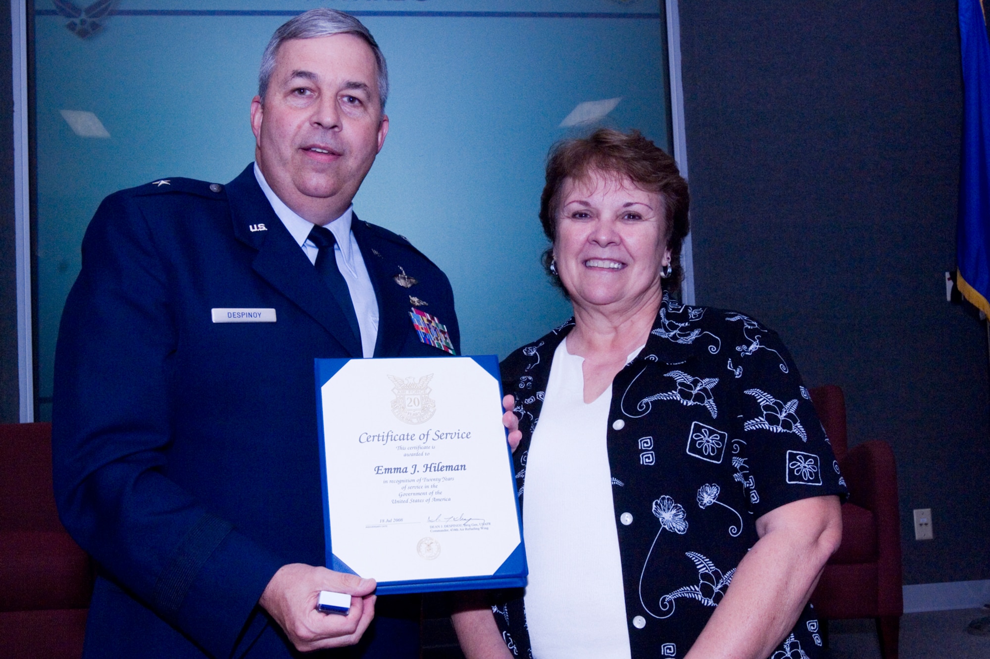 GRISSOM AIR RESERVE BASE, Ind., -- Emma Hileman, 434th Maintenance Operations Flight, receives a pin and certificate from Brig. Gen. Dean Despinoy, 434th Air Refueling Wing commander, marking her 20 years of federal service. The presentation was made during a civilian commander's call held recently. (U.S. Air Force photo/Tech. Sgt. Doug Hays)