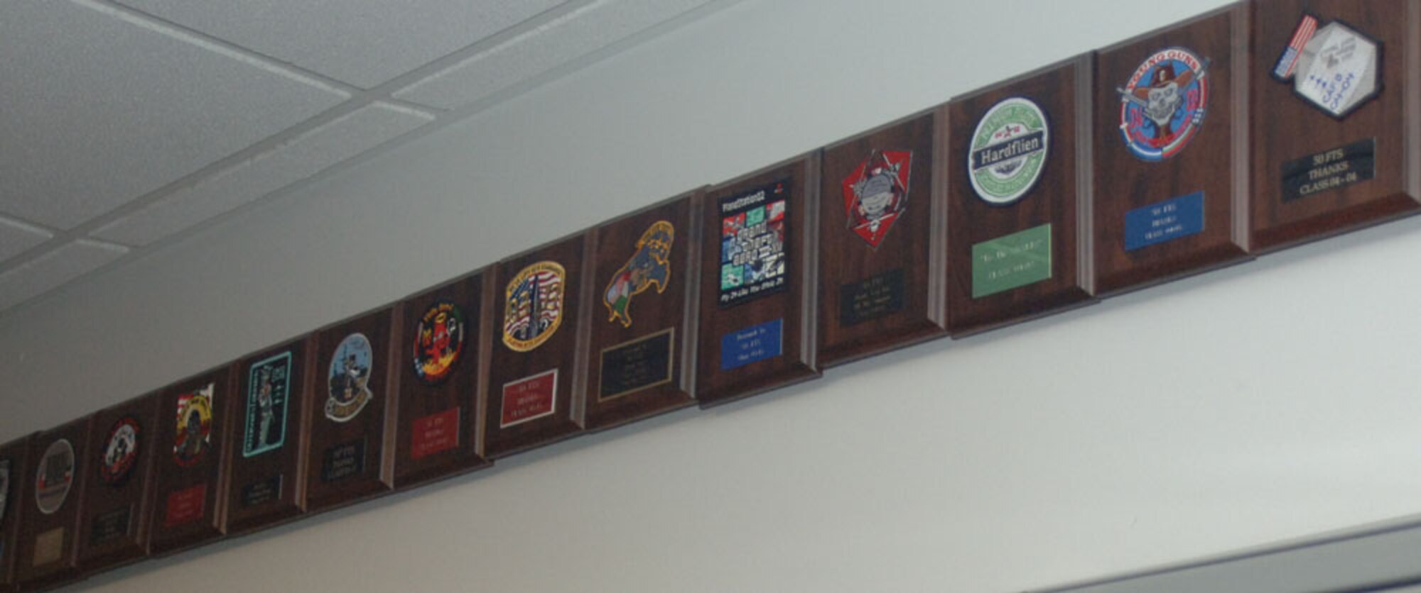 Plaques featuring the patches of former Specialized Undergraduate Pilot Training classes line the hallways of the 50th Flying Training Squadron. The 50th FTS flies the T-38C Talon in phase two of pilot training. (U.S. Air Force photo by Senior Airman Danielle Hill)


