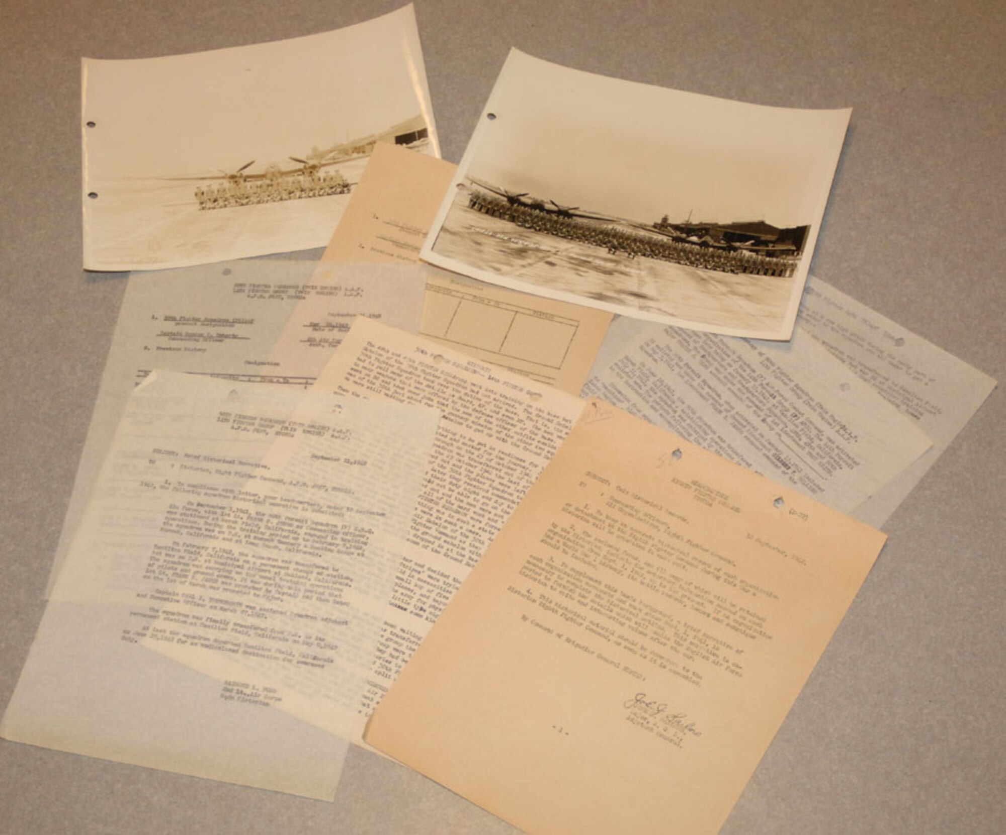 Recently, retired Maj. Thomas Youngsworth donated the above historical documents which had been given to him by his father, retired Lt. Col. Carl Youngsworth. These pieces of heritage highlight the early days of the 50th FTS after its activation following Pearl Harbor. Colonel Youngsworth was a captain at the time in this squadron and collected these pieces of memorabilia which have now been returned to the squadron. (U.S. Air Force photo by Senior Airman Danielle Hill)

