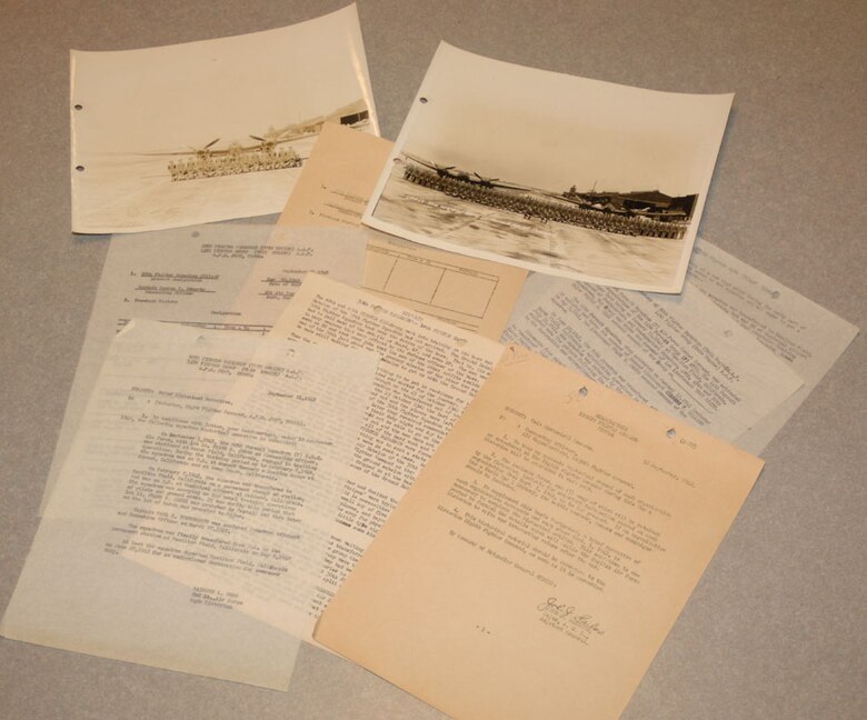 Recently, retired Maj. Thomas Youngsworth donated the above historical documents which had been given to him by his father, retired Lt. Col. Carl Youngsworth. These pieces of heritage highlight the early days of the 50th FTS after its activation following Pearl Harbor. Colonel Youngsworth was a captain at the time in this squadron and collected these pieces of memorabilia which have now been returned to the squadron. (U.S. Air Force photo by Senior Airman Danielle Hill)

