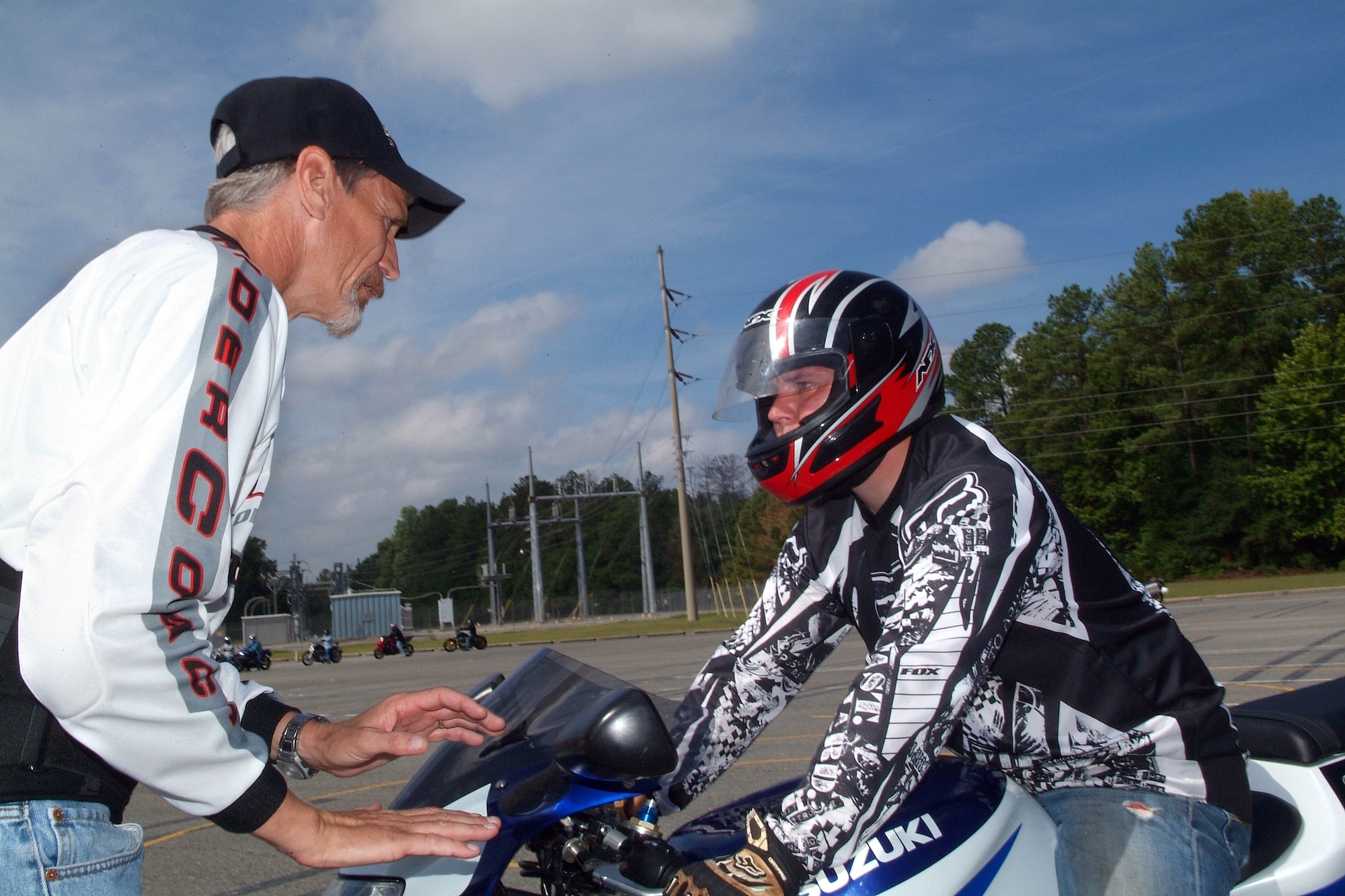 Motorcycle Safety Instructor, Donn Johnson, instructs Senior Airman Ken Zupkow, an airborne radar technician in the 116th Air Control Wing’s 12th Airborne Command and Control Squadron, on motorcycle safety and bike maneuvering during a motorcycle training exercise at the base bike safety riding course.  See page A-6 for questions posed by Team Robins personnel and answers from leadership about motorcycle ridership on Robins. U.S. Air Force photo by tommie horton