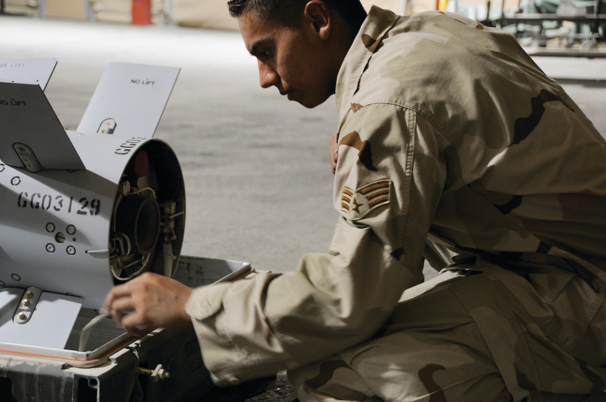 Senior Airman Anthony Bonillo, 379th Expeditionary Maintenance Squadron, checks the ignition fuse the AGM 65 Missile here Aug. 19. Checking the fuse is one of the critical steps in a visual inspection of a missile. Airman Bonilla is a native of Brooklyn, N.Y., and is deployed from Nellis Air Force Base, Nev., in support of Operations Iraqi Freedom, Enduring Freedom and Joint Task Force-Horn of Africa. (U.S. Air Force photo by Tech. Sgt. Michael Boquette)