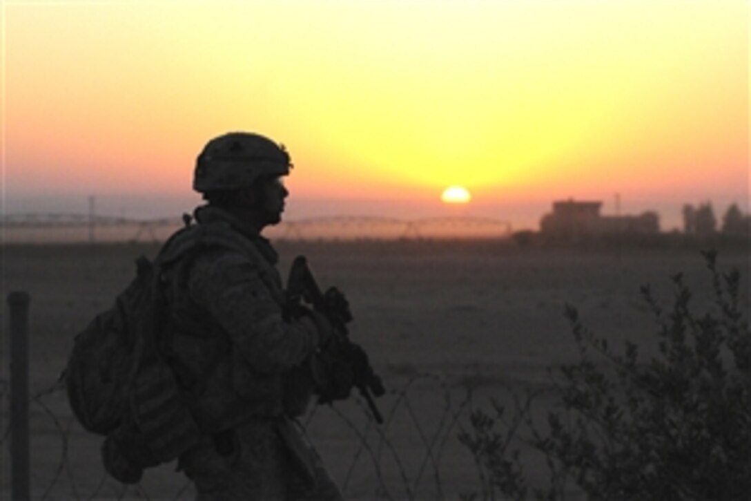 A U.S. Army soldier pulls security as other members of his unit move to known safe houses of al-Qaida during Operation Cretan, in the Salah ad Din province, Iraq, Aug. 8, 2008. The soldiers are assigned to the 1st Special Troops Battalion, 1st Brigade Combat Team, 101st Airborne Division, which conducted a combined air assault with Iraqi police. 