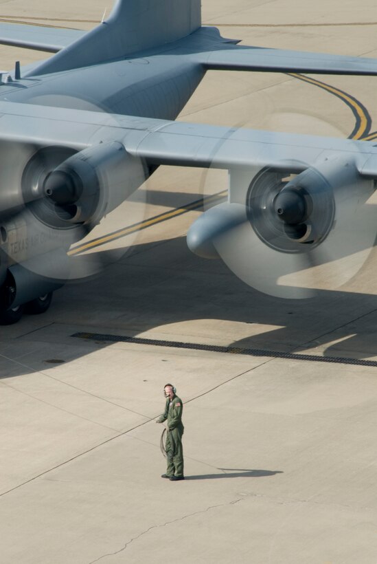 A lone aircrew member stands by during engine start during the 181st Airlift Squadron Airlift Rodeo at the June Unit Training Assembly at NAS/JRB, Carswell Field, Fort Worth,Texas, June 28, 2008.(USAF photo MSgt M Lachman)