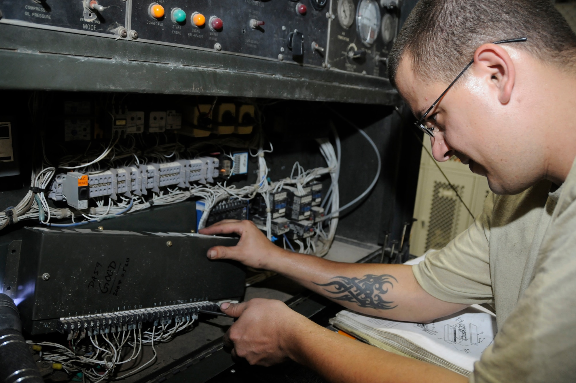 Senior Airman Eric Braland, aerospace ground equipment (AGE) maintainer, assigned to the 379th Expeditionary Maintenance Squadron, replaces a temperature control on a MA3D air conditioning unit Aug. 23, 2008, at an undisclosed air base in Southwest Asia. Airman Braland is responsible for maintaining equipment required to support Air Force aircraft while on the tarmac. Airman Braland, a native of Omaha, Neb., is deployed from Offutt Air Force Base, Neb., in support of Operations Iraqi Freedom, Enduring Freedom and Joint Task Force-Horn of Africa. (U.S. Air Force photo by Staff Sgt. Darnell T. Cannady/Released)