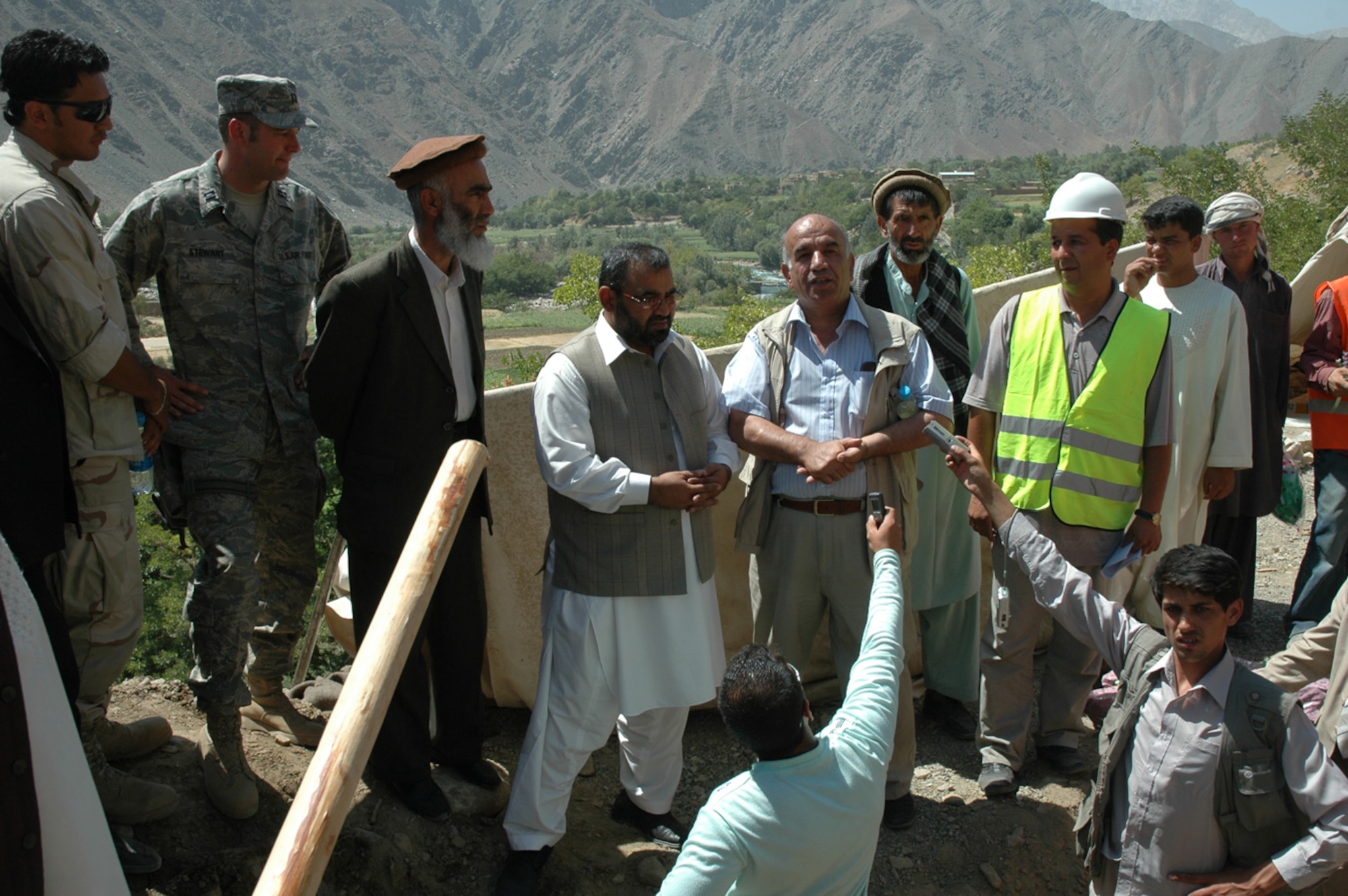 Abdul Rahman Panjshiri speaks to the crowd during a special ground-breaking ceremony for the $130,000 Haish Saidqi eight-room schoolhouse, Aug. 20, on a hillside overlooking the picturesque stepped farmlands of Rokha District, in Panjshir province, Afghanistan.  Panjshiri donated the land for the school. (U.S. Air Force photo by Capt. Jillian Torango/Released)