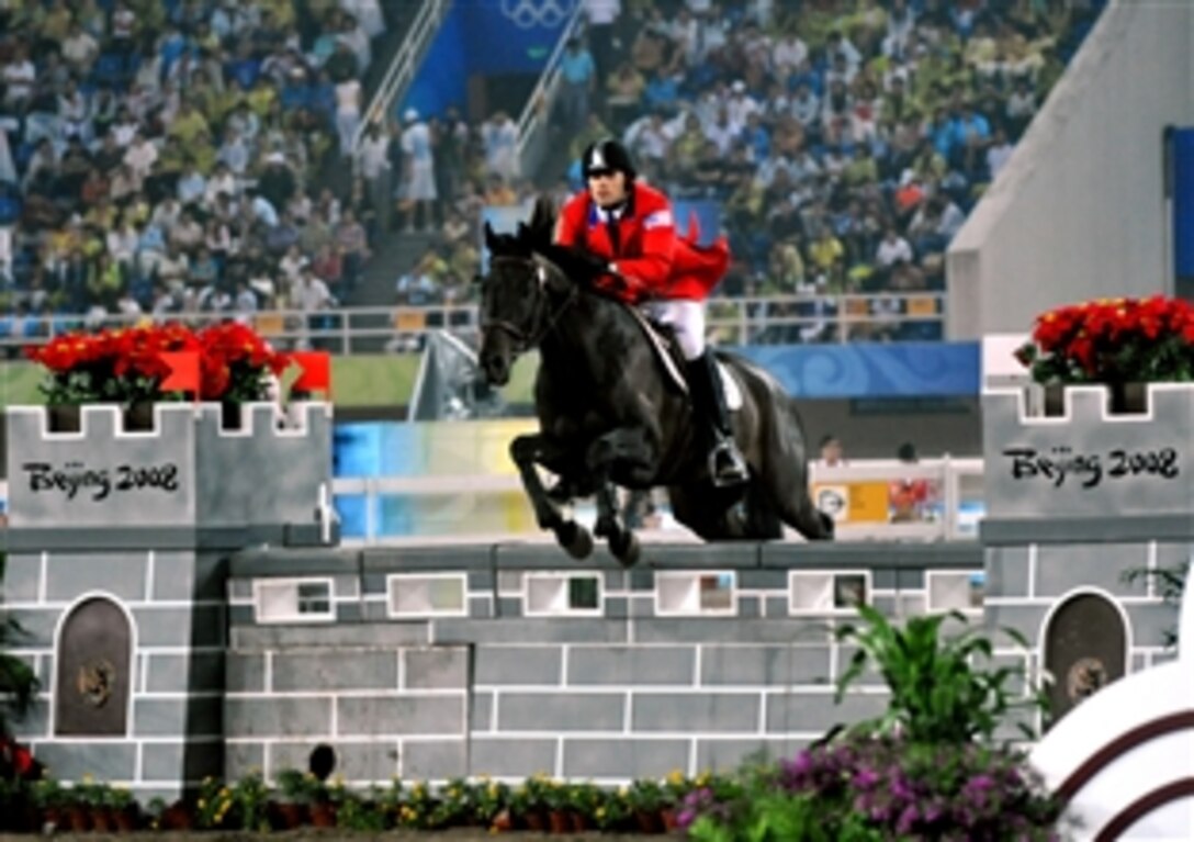U.S. Air Force World Class Athlete Program Capt. Eli Bremer rides Dangdang to a 14th-place finish worth 1,060 points in the equestrian show jumping portion of the modern pentathlon, Aug. 21, 2008, at the Olympic Sports Center Stadium in Beijing. Bremer finished 23rd in the five-sport event that includes pistol shooting, fencing, swimming, riding show jumping and running with 5,204 points. 

