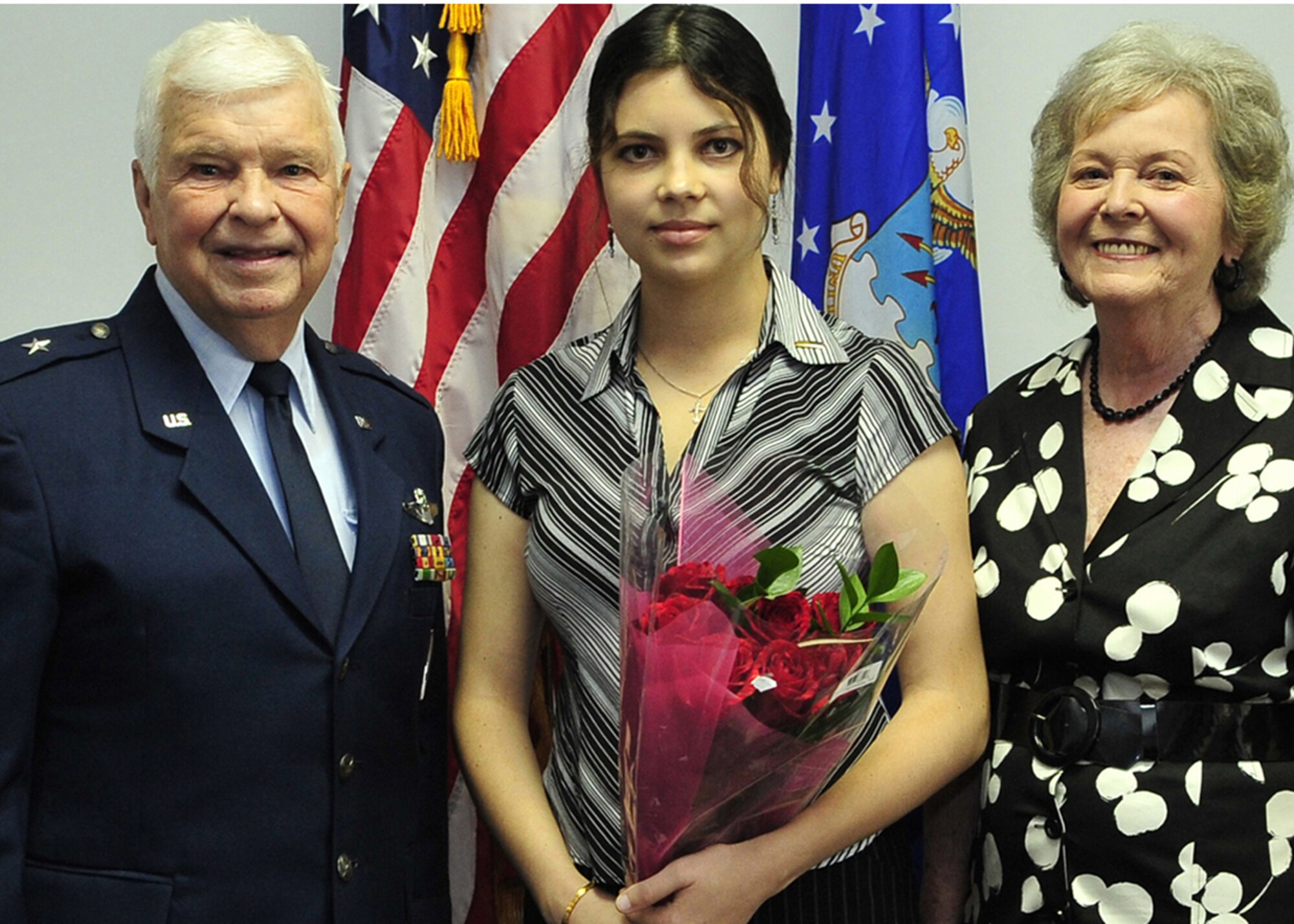 Maria Kravchenko pauses for a photo Aug. 7 with family friends retired Brig. Gen. James Albritton and his wife, Pat, after the general administered the oath of office to Ms. Kravchenko in Gainesville, Fla. The newly commissioned 18-year-old Air Force Reserve second lieutenant will attend medical school in the fall with help from the Air Force Medical Corps Health Professions Scholarship Program.  (U.S. Air Force photo/Senior Airman Elizabeth Rissmiller) 
