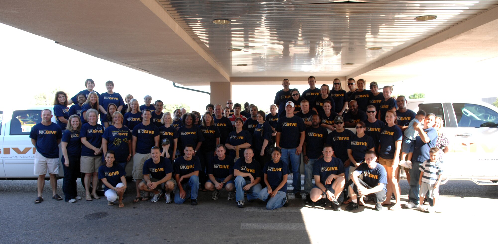 All participants of the Big Give challenge posed for a photograph during the Big Give After Party at the Enlisted Club at Holloman Air Force Base, N.M., August 21. There were more than 150 participants in the challenge all split up into different teams. At the end of the after party, the Housebusters team was named the winner, and received a $5,000 check for their efforts in giving back to the community. (U.S. Air Force photo/Airman Sondra M. Wieseler)