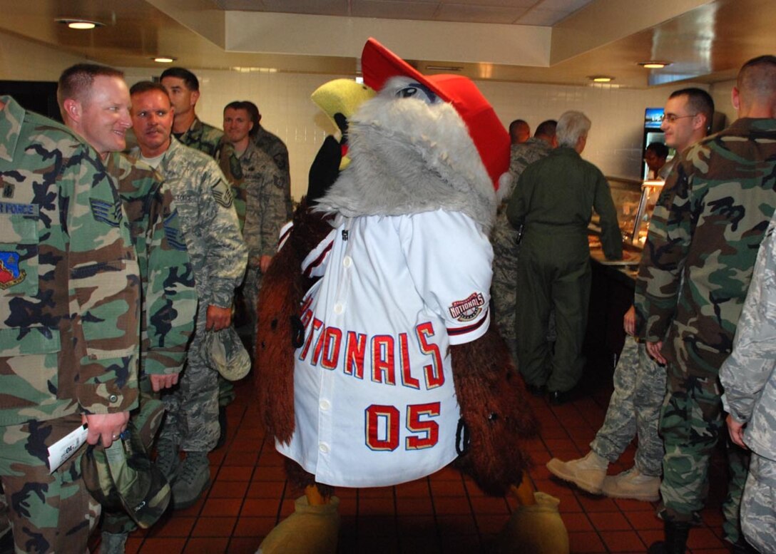 The Washington D.C. Nationals baseball team mascot Screech dances to entertain Airmen while handing out free baseball tickets to Friday's game at the Freedom Hall Dining Facility Aug. 25.