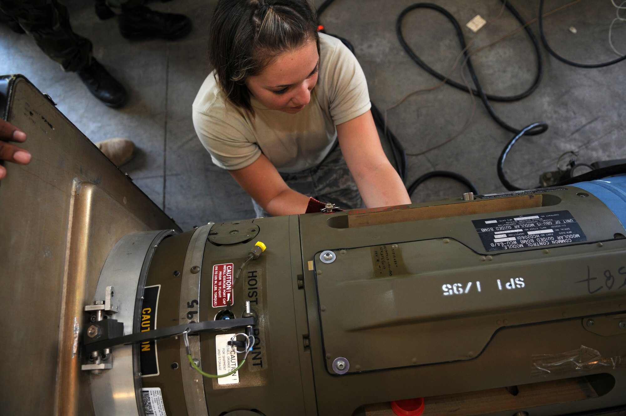 Senior Airman Keegan Vanderpoel, a munitions specialist with the 4th Equipment Maintenance Squadron, Seymour Johnson Air Force Base, N.C., builds a precision-guided munition here July 30 in preparation for the Air Force air-to-ground Weapons System Evaluation Program known as Combat Hammer. During the Aug. 4-22 event, four units deployed to Hill AFB and six units travelled directly to the Utah Test and Training Range to drop munitions in realistic combat scenarios. With support from the 388th Range Squadron, Airmen in Eglin AFB's 86th Fighter Weapons Squadron, 53rd Wing, will collect and analyze data on how these precision weapons performed and their suitability for use in War on Terror deployments. (U.S. Air Force photo by James Arrowood) 