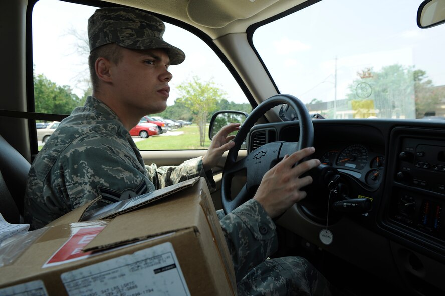 MOODY AIR FORCE BASE, Ga. -- Airman 1st Class David Definbaugh, 23rd Logistics Readiness Squadron vehicle operator, drives a government vehicle to deliver a mission-capable package to the 723rd Aircraft Maintenance Squadron here Aug. 7. A mission-capable part must be delivered within 30 minutes of receiving the package at the pick up and delivery office. (U.S. Air Force photo by Senior Airman Brittany Barker)