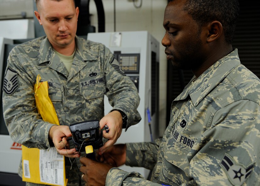 MOODY AIR FORCE BASE, Ga. -- Airman 1st Class Brian Higgs, 23rd Logistics Readiness Squadron vehicle operator, delivers a package to the aircraft metals technology office here Aug. 7. The LRS pick-up and delivery flight will combine with the traffic management office to ease the distribution process. (U.S. Air Force photo by Senior Airman Brittany Barker)