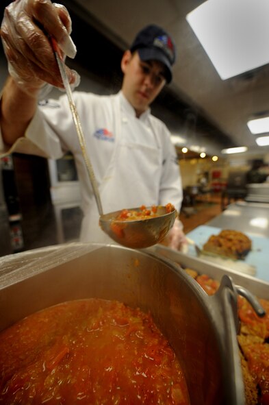 MOODY AIR FORCE BASE, Ga. – Airman 1st Class Joshua Burdy, 23rd Force Support Squadron food specialist, prepares cajun meat loaf here Aug. 20. The Georgia Pines Dining Facility recently merged from the 23rd Services Squadron to the 23rd FSS. (U.S. Air Force photo by Senior Airman Gina Chiaverotti)