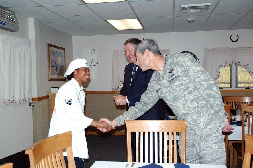Senior Airman Chanice Reid welcomes Air Force Chief of Staff Gen. Norton A. Schwartz to Bravo-01 missile alert facility as acting Secretary of the Air Force Michael B. Donley looks on. The top two Air Force officials were in Great Falls, Mont. on Aug. 22 to meet with key personnel and Airmen from Montana's Air National Guard and Malmstrom Air Force Base, Mont. Airman Reed is a 10th Missile Squadron chef. (U.S. Air Force photo/Senior Airman Emerald Ralston) 