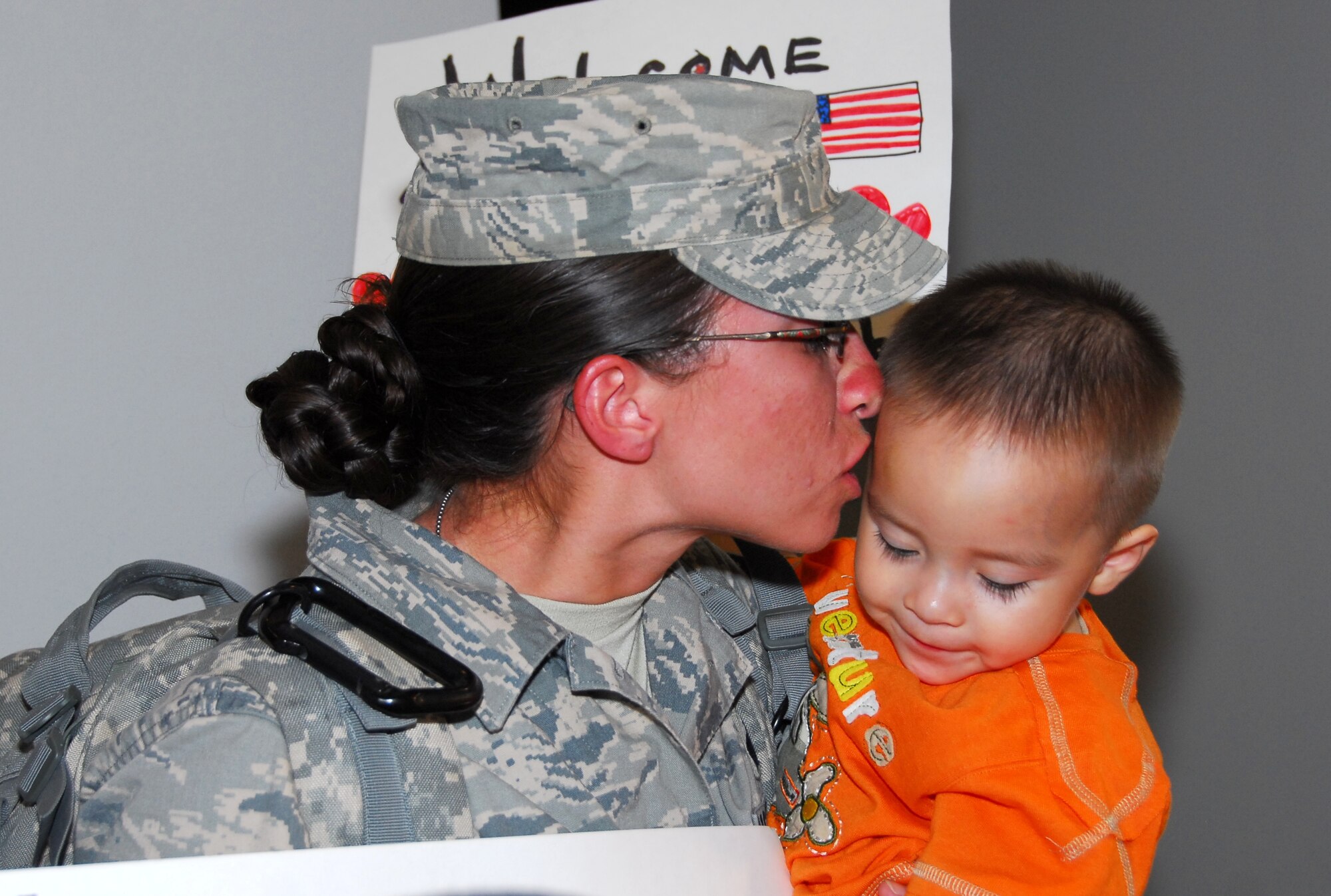 Staff Sgt. Haley Bia kisses her son Ethan. All 19 of the 162nd Fighter Wing’s Security Forces members returned home safely Aug. 23 after six months in Iraq. (Air National Guard photo by Master Sgt. Dave Neve)