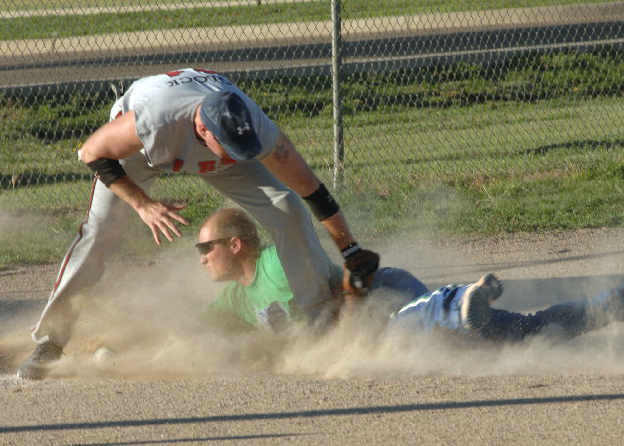 CANNON AIR FORCE BASE, N.M. - Staff Sgt Wesley Cummins, 27th Special Operations Equipment Maintenance Squadron, slides into third base, and is called safe during the Cannon Intramural Softball Championship. Sergeant Cummins was the pitcher of the ACES softball team, who won the championship game August 21. (U.S. Air Force photo/ Airman 1st Class Danielle Martin)