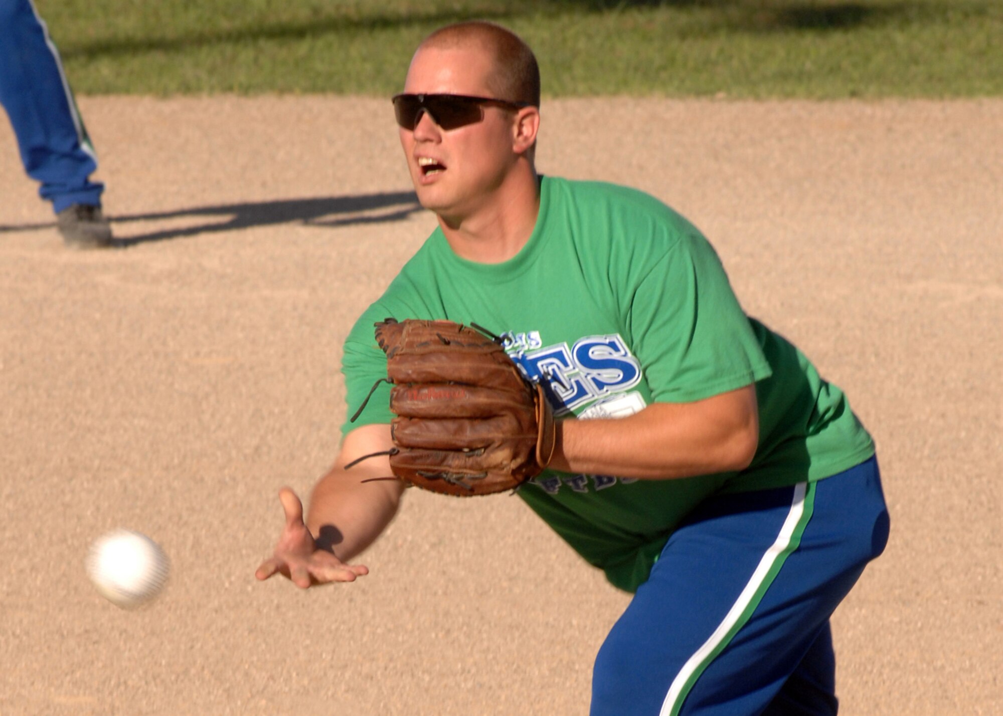 CANNON AIR FORCE BASE, N.M. - Staff Sgt. Wesley Cummins, 27th Special Operations Equipment Maintenance Squadron, pitches during the Cannon Intramural Softball Championship. Sergeant Cummins played with the ACES softball team, who won the championship game August 21. (U.S. Air Force photo/ Airman 1st Class Danielle Martin)