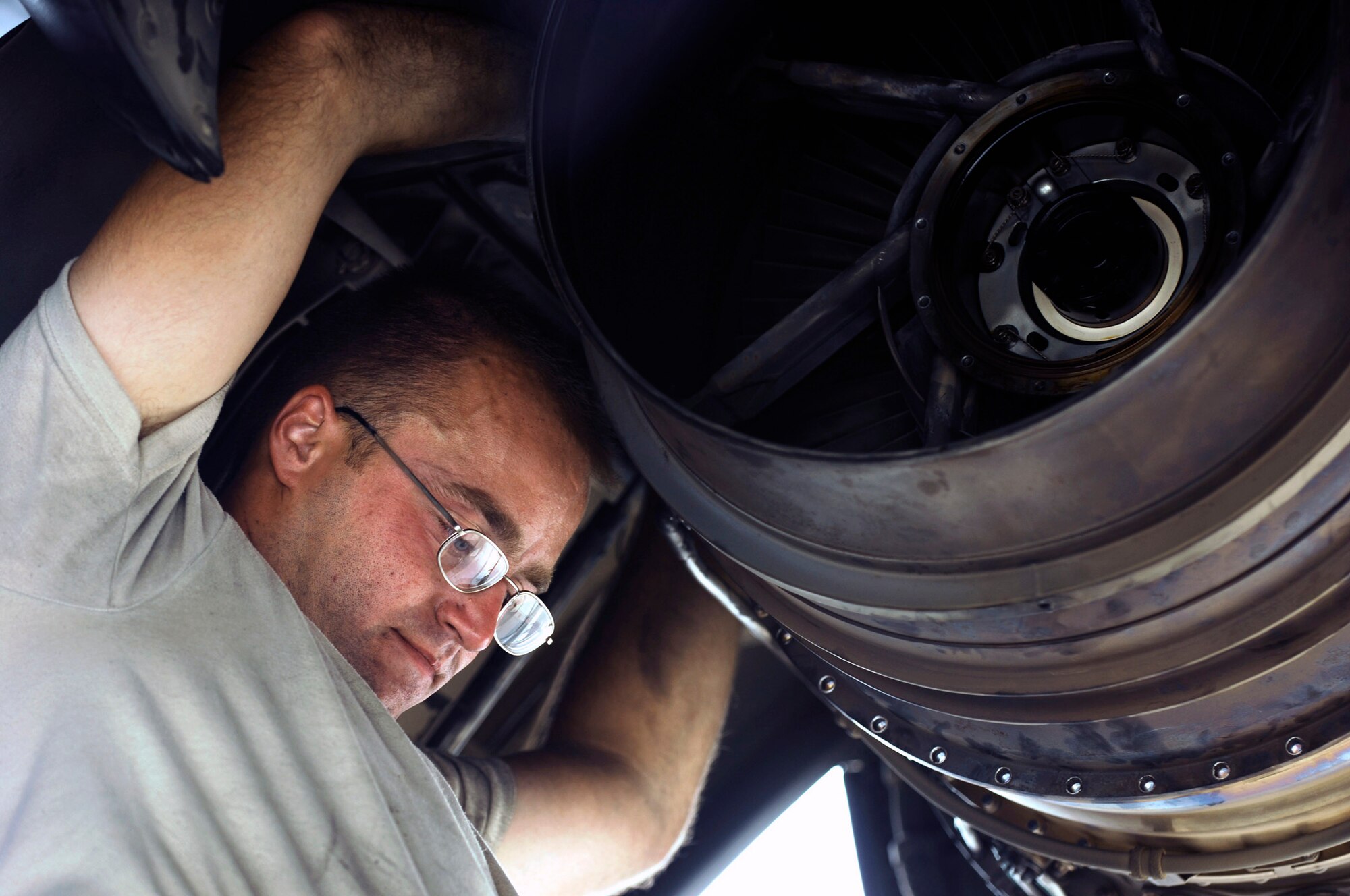 Senior Airman Sean Sweeney unscrews a bolt from the rear bearing support on a C-130 Hercules engine during a post-flight inspection Aug. 22 at Joint Base Balad, Iraq. Airman Sweeney is an aerospace propulsion technician with the 777th Expeditionary Aircraft Maintenance Squadron deployed from Little Rock Air Force Base, Ark. His hometown is Fort Worth, Texas. (U.S. Air Force photo/Airman 1st Class Jason Epley) 