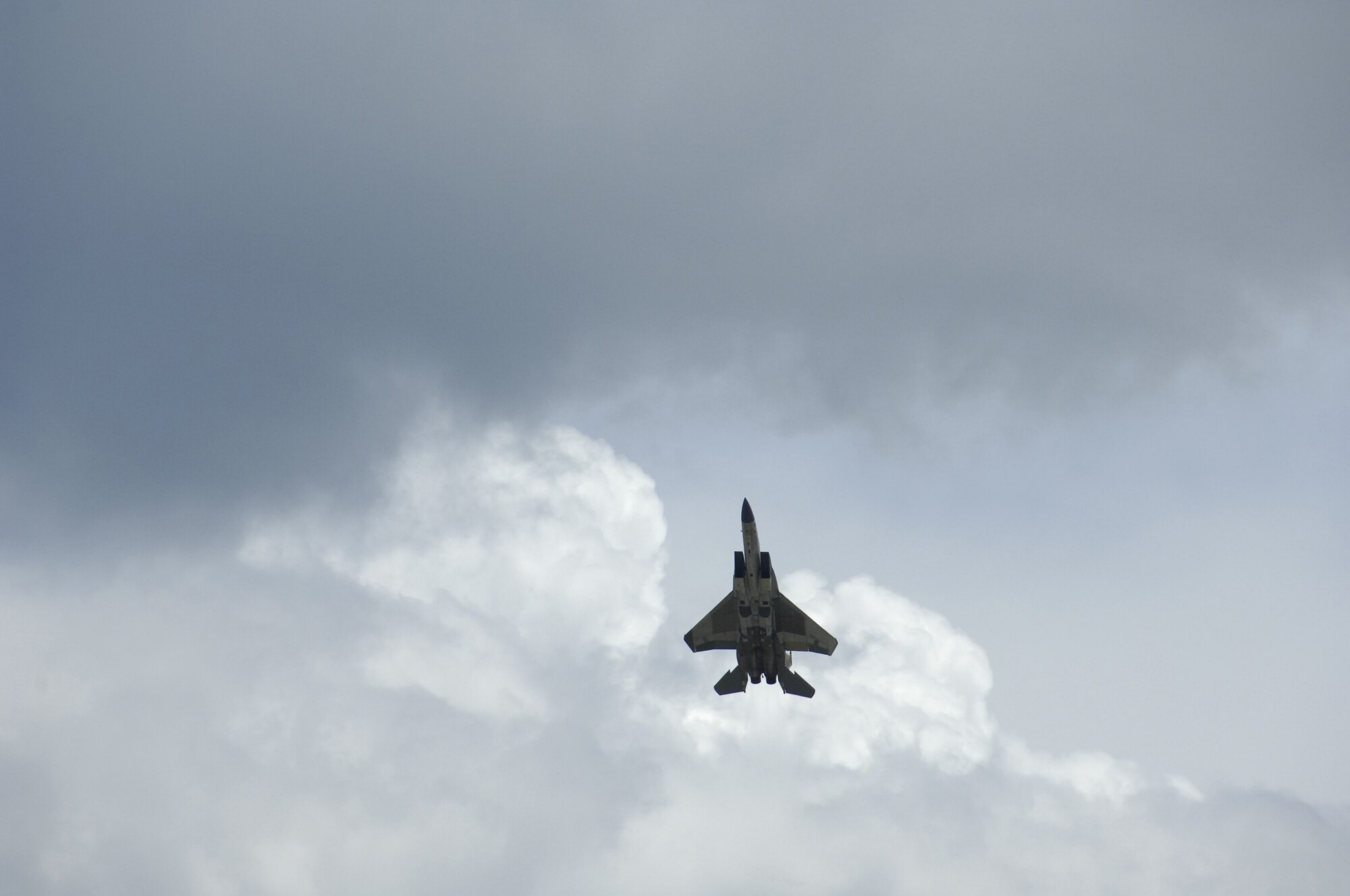 Maj. Dan Badia, with the Air Force Reserve's 339th Flight Test Squadron, Robins Air Force Base, Ga., pilots an F-15E Strike Eagle during the first test flight of a synthetic fuel blend in an Air Force fighter aircraft. (U.S. Air Force photo/Claude Lazarro)