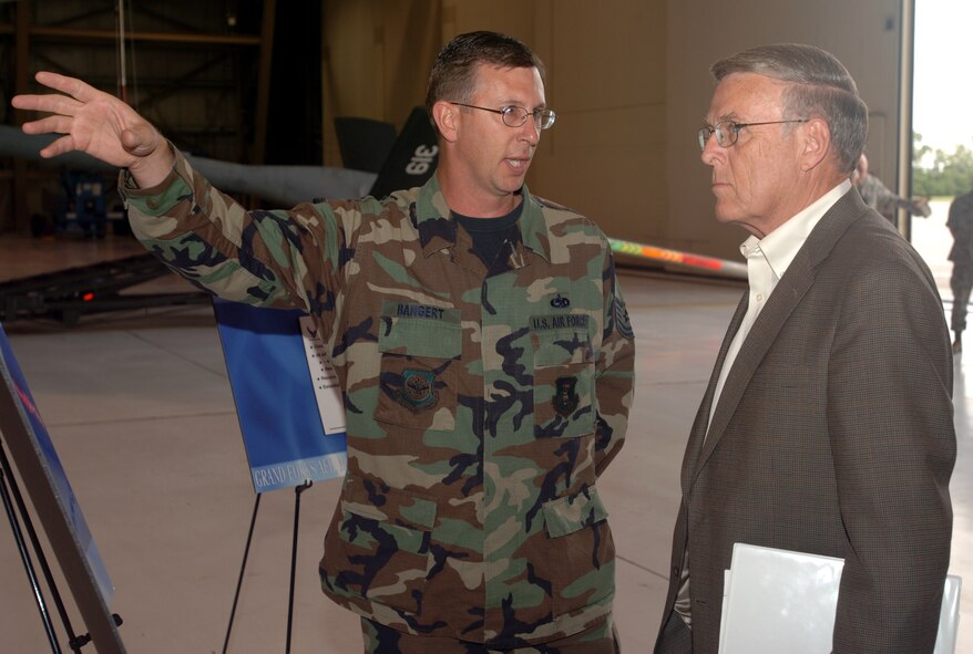 Tech. Sgt. Dale Bangert, 319 MXS, discusses new ways of accomplishing inspections and repairs on the KC-135 Stratotanker aircraft with U.S. Senator Byron Dorgan (N.D.) during a visit to the base Aug. 22.  The senator met with wing leaders, toured the base, visited with members of the maintenance group and shook hands with Airmen at a base picnic.  This visit was the first since the change of command in July. (U.S. Air Force photo/Tech. Sgt. Joseph Kapinos)