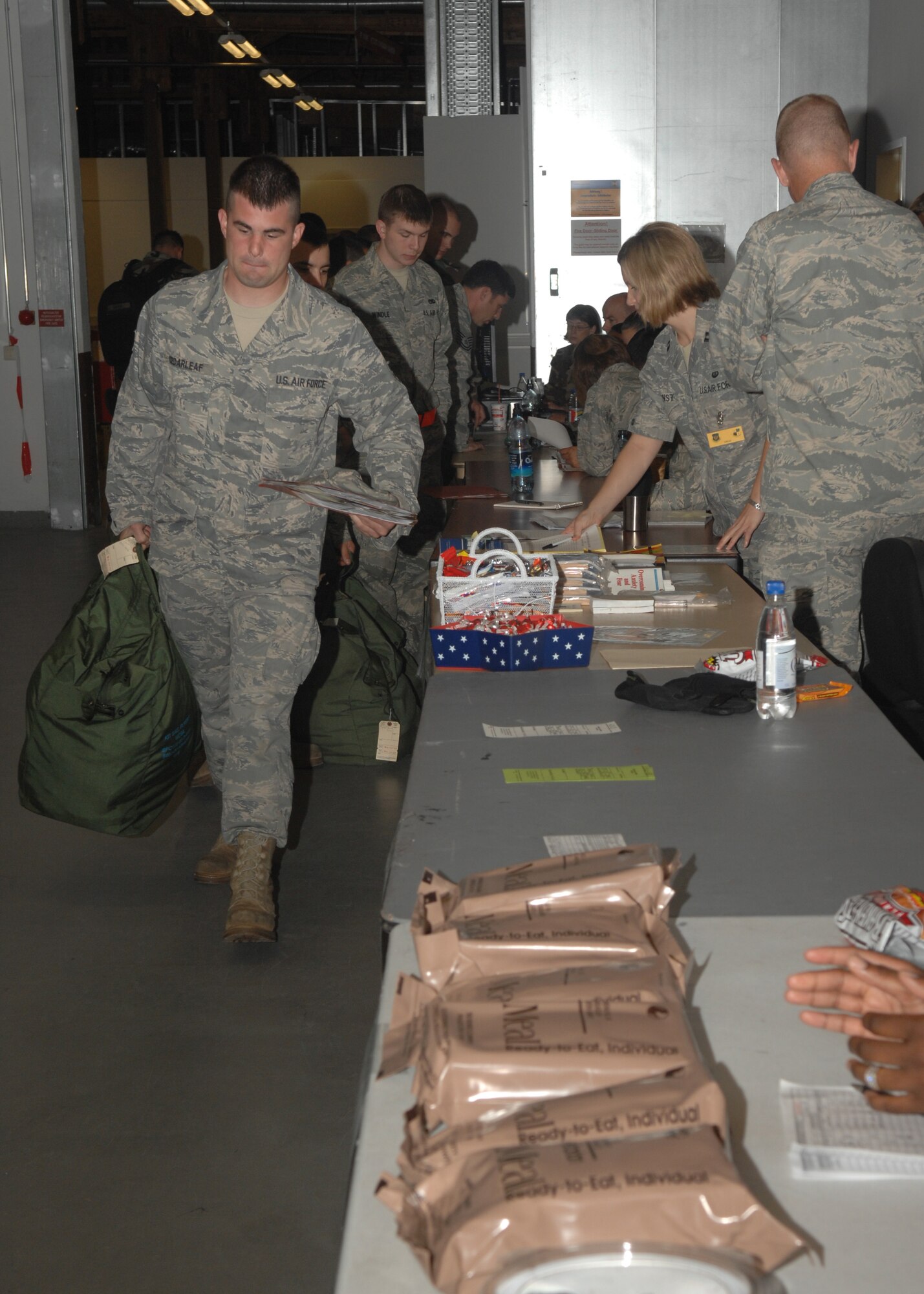 SPANGDAHLEM AIR BASE, Germany – Staff Sgt. Justin Cedarleaf, 52nd Component Maintenance Squadron, moves to the Force Support station during the Personal Deployment Function portion of the exercise, Aug. 23, 2008. During the exercise, 52nd Fighter Wing Airmen met with numerous services including personnel, finance, and postal to prepare themselves for deployment. (U.S. Air Force photo by Airman Staci Miller)
