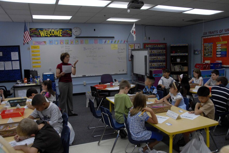OSAN AIR BASE, Republic of Korea – Students in Mrs. Albata’s third grade class listens as she explains the first-day of school assignments. Osan American Elementary School's students began school Aug. 25. (U.S. Air Force photo/Staff Sgt. Candy Knight)