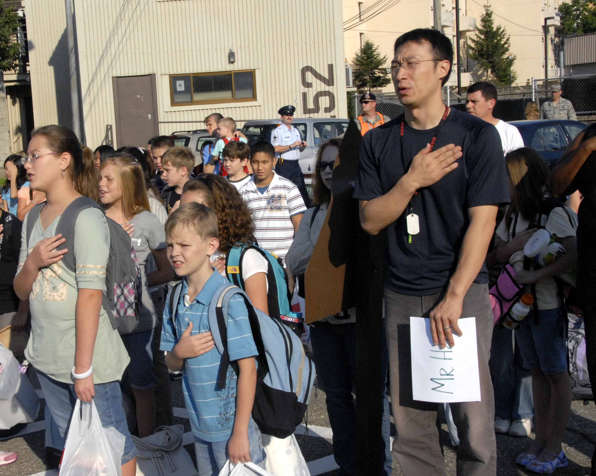 OSAN AIR BASE, Republic of Korea – Parents, teachers and students recite the Pledge of Allegiance during Osan American Elementary School’s first-day of school activities Aug. 25. (U.S. Air Force photo/Staff Sgt. Candy Knight)
