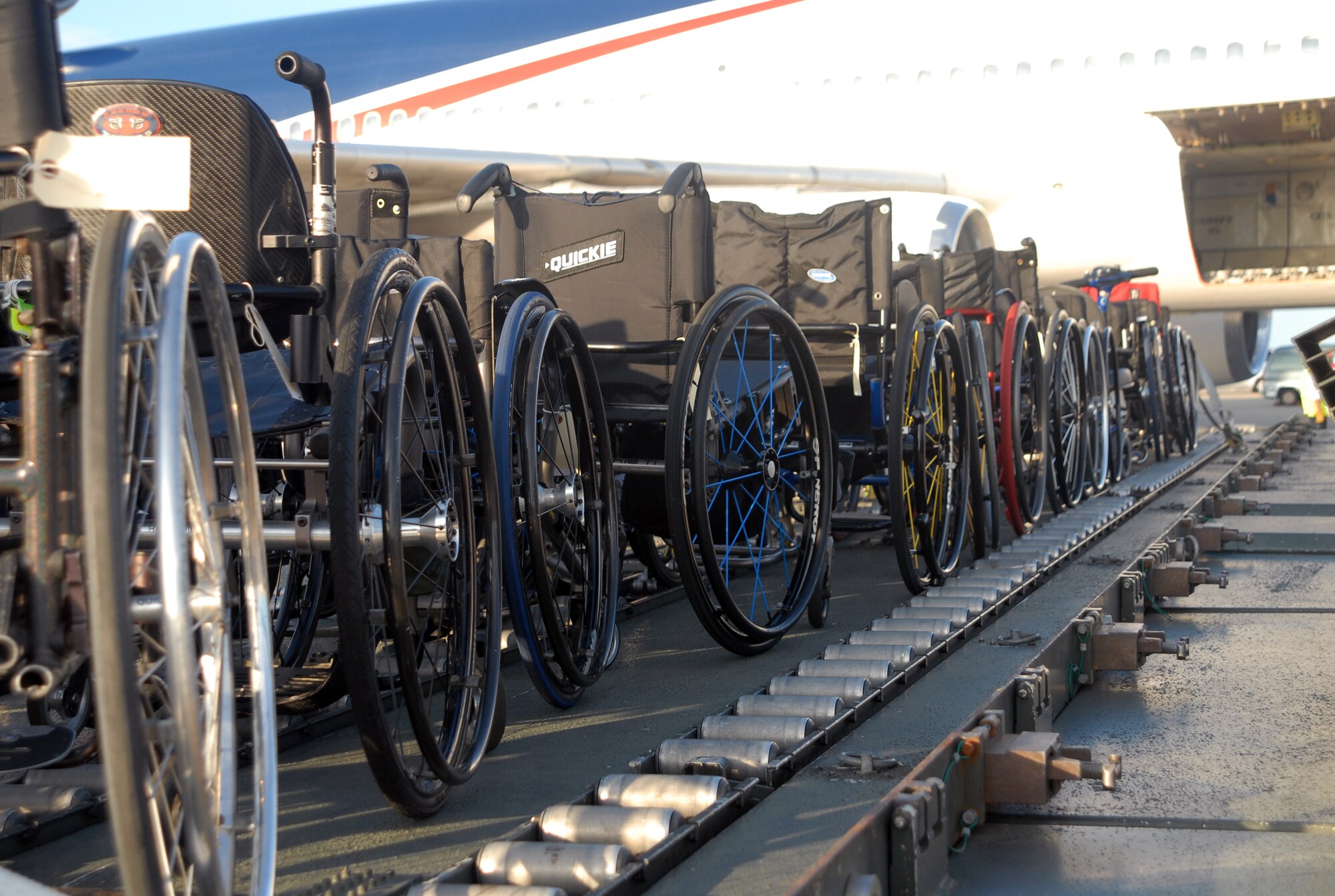 Wheelchairs are taken off an arriving aircraft and prepared for
transportation as Team Kadena welcomes the U.S. Paralympic athletes on
Kadena's flightline Aug. 24 The athletes will spend the week on base in
preparation for the 2008 Beijing Paralympics.  (U.S. Air Force photo/Staff
Sgt. Christopher Marasky)
